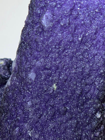A close-up of purple fluorite covered quartz points