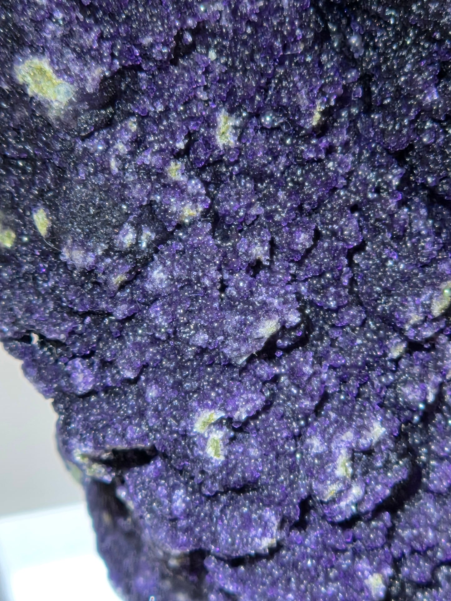 A close-up of purple fluorite covered quartz points