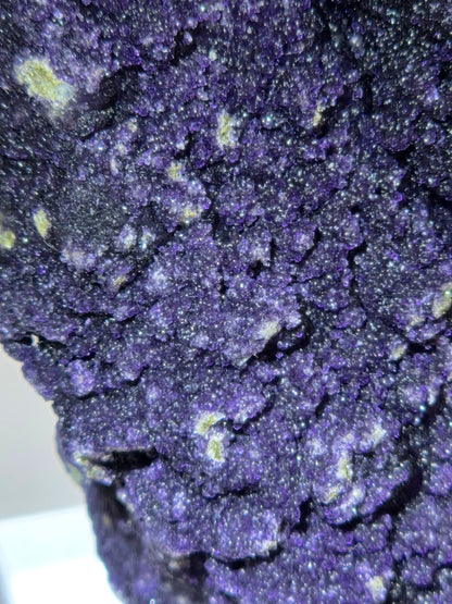 A close-up of purple fluorite covered quartz points