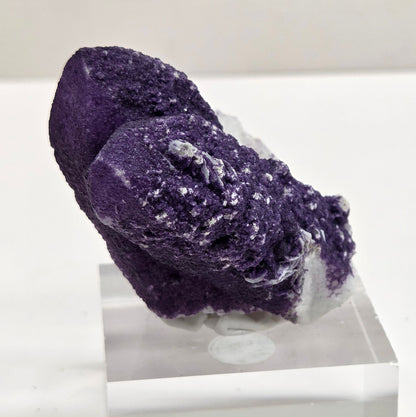 A collection of purple fluorite covered quartz points