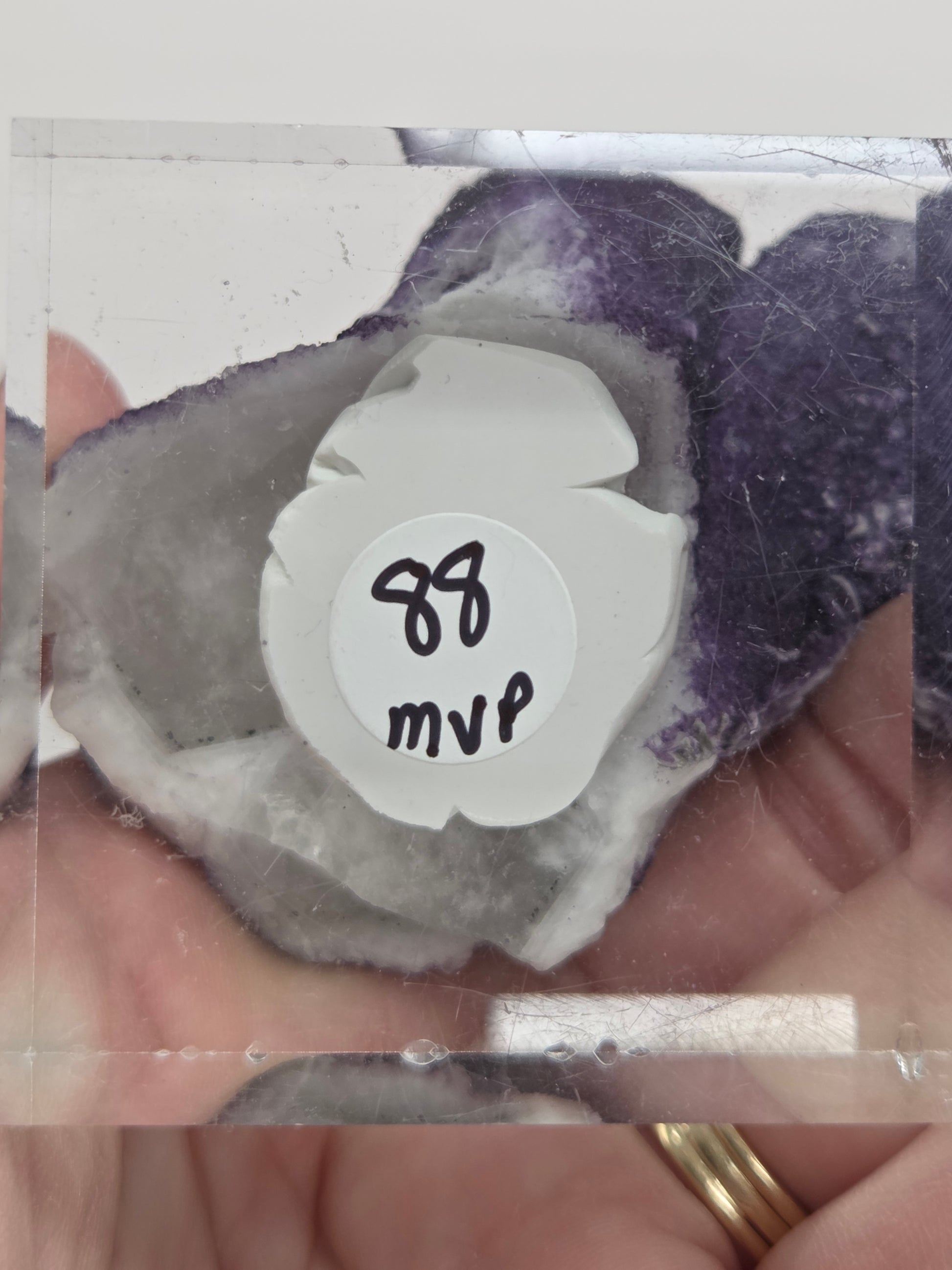 A collection of purple fluorite covered quartz points