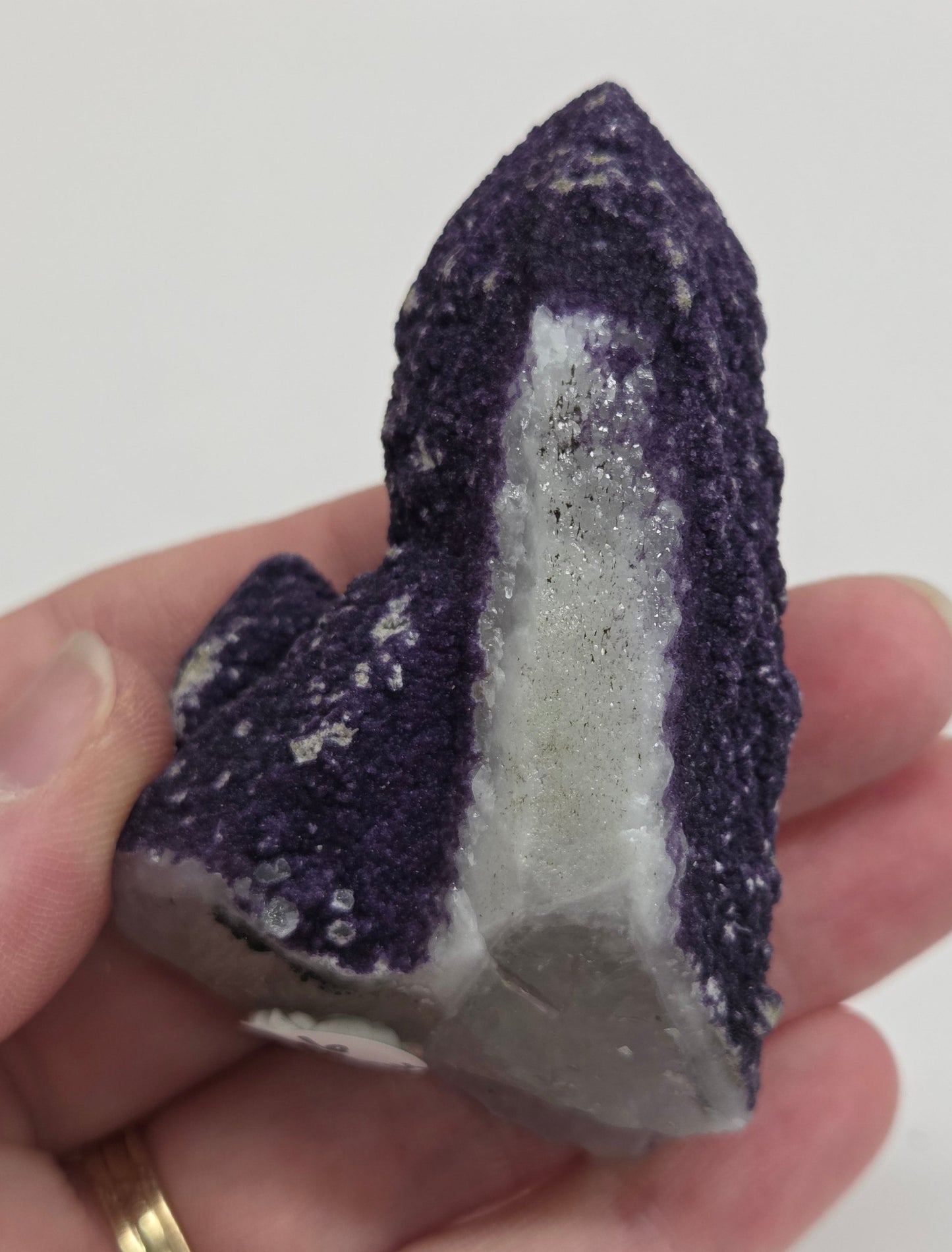 A collection of purple fluorite covered quartz points