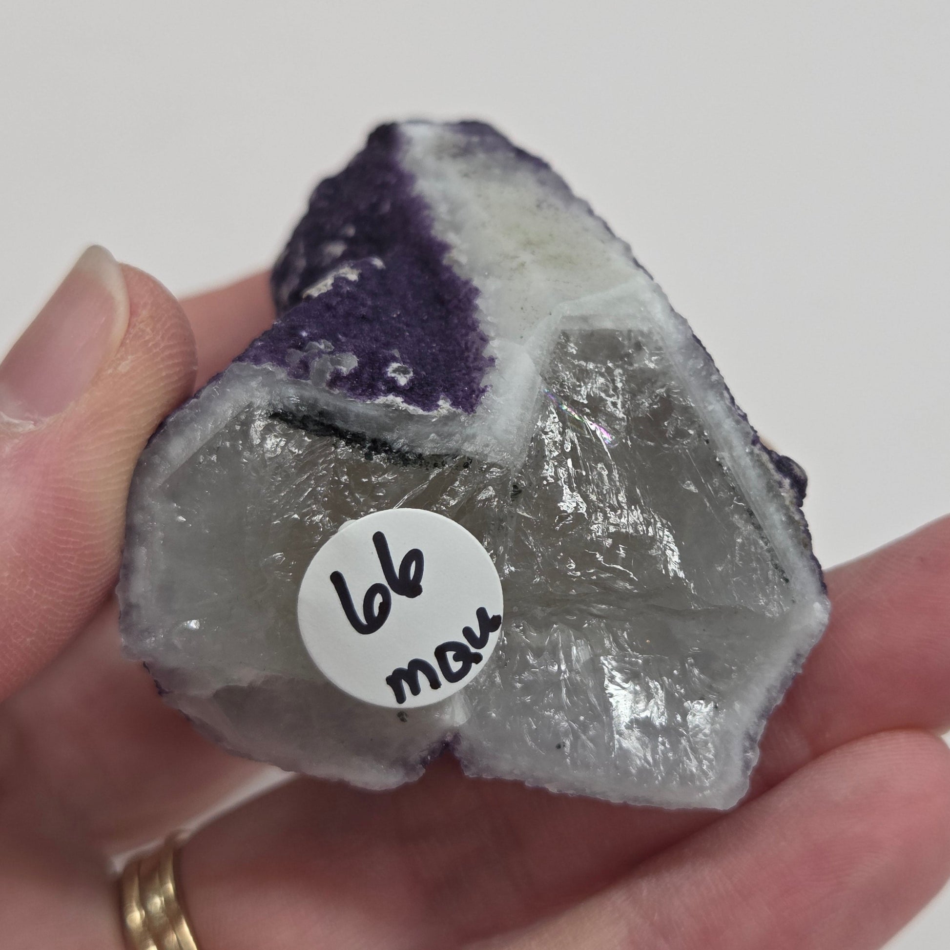 A collection of purple fluorite covered quartz points