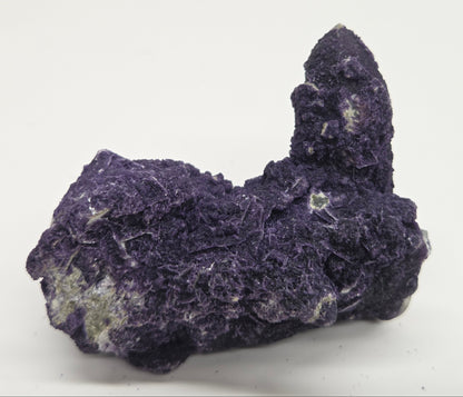 A collection of purple fluorite covered quartz points