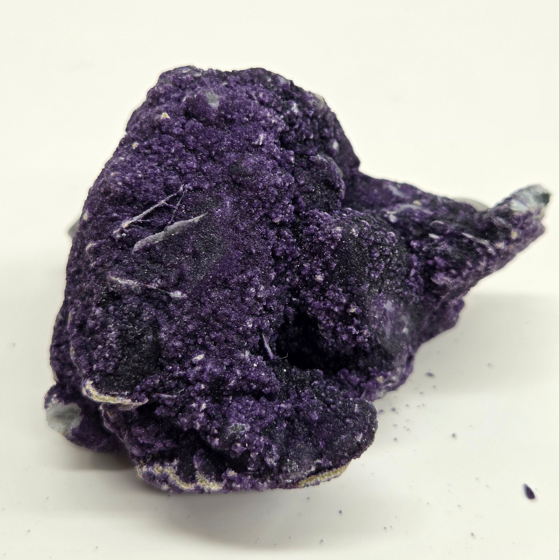 A collection of purple fluorite covered quartz points