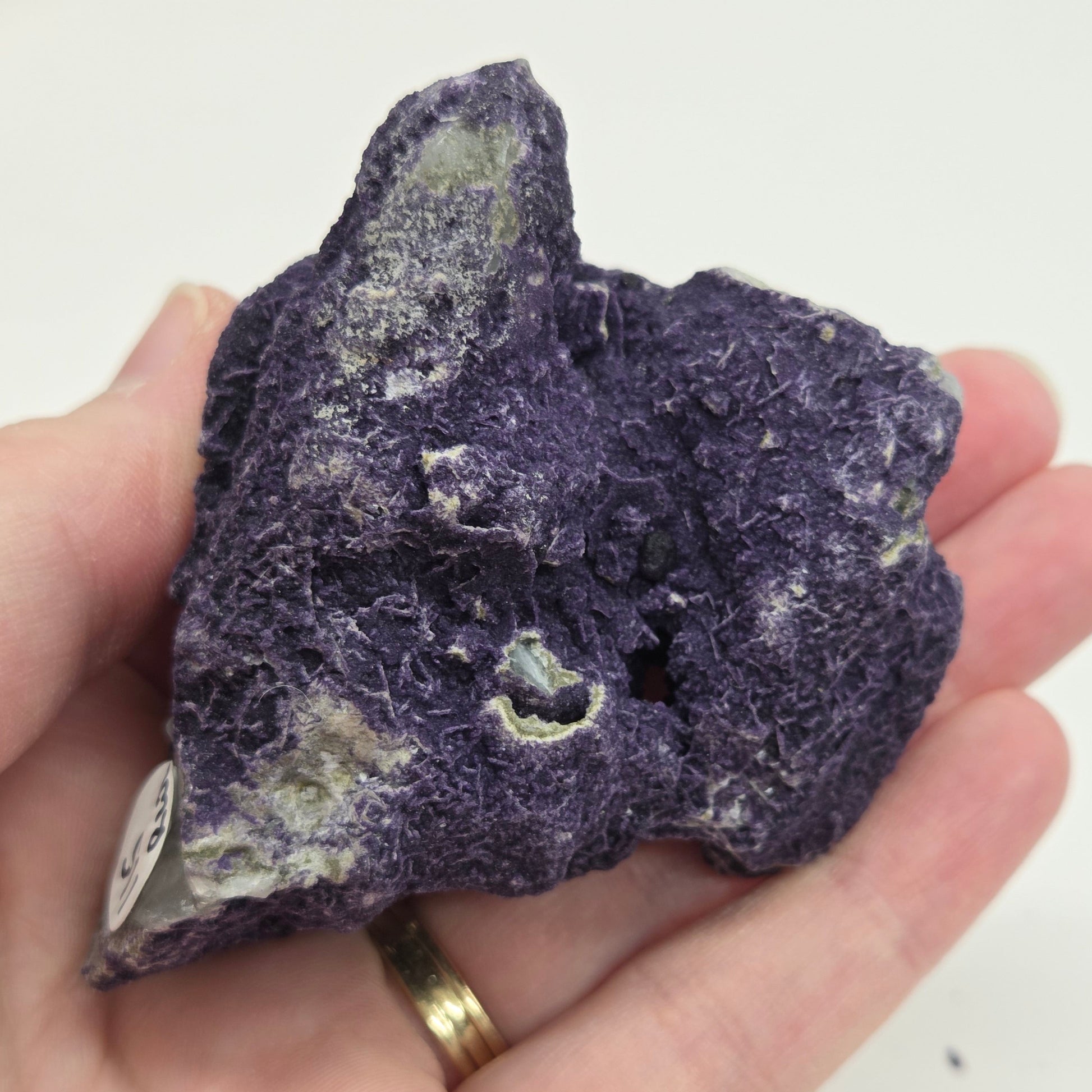 A collection of purple fluorite covered quartz points