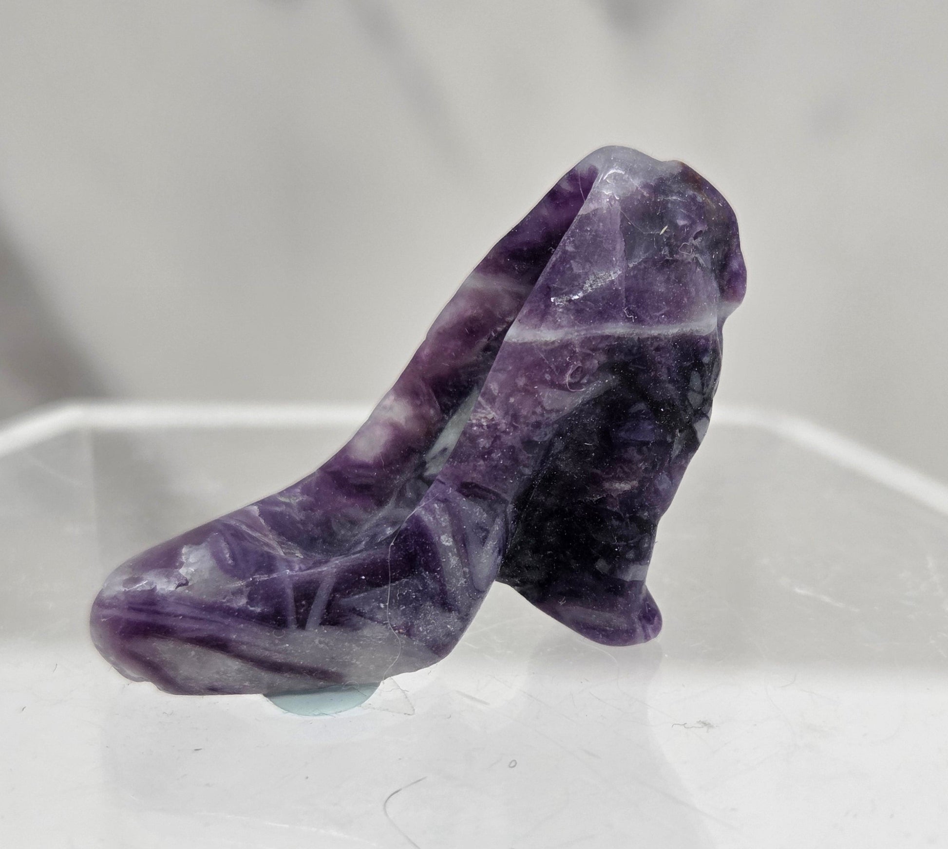 Fluorite Root high heel crystal carving against a grey background