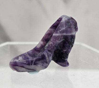 Fluorite Root high heel crystal carving against a grey background