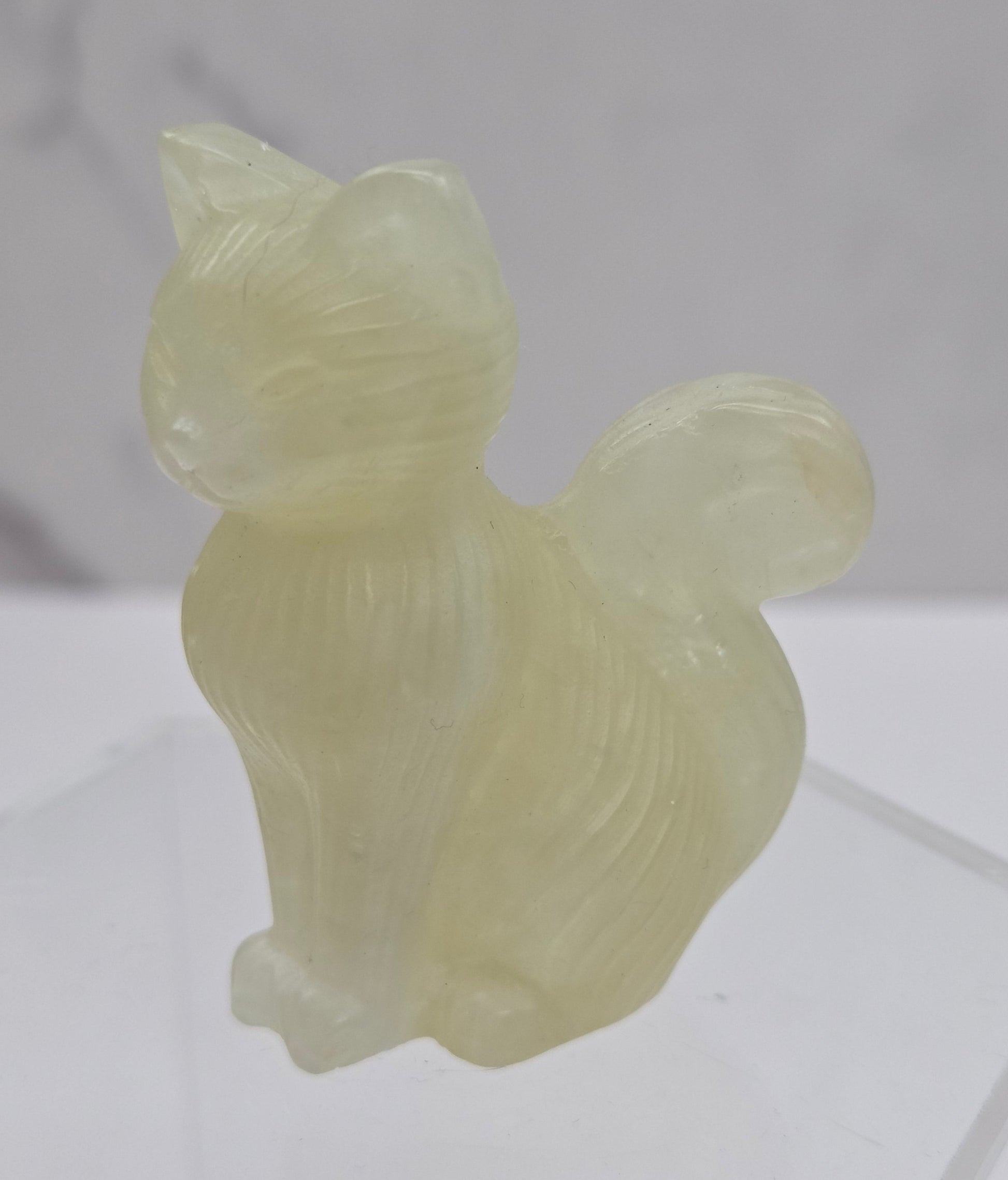 Crystal cat figurine made of Citrine  on a white background