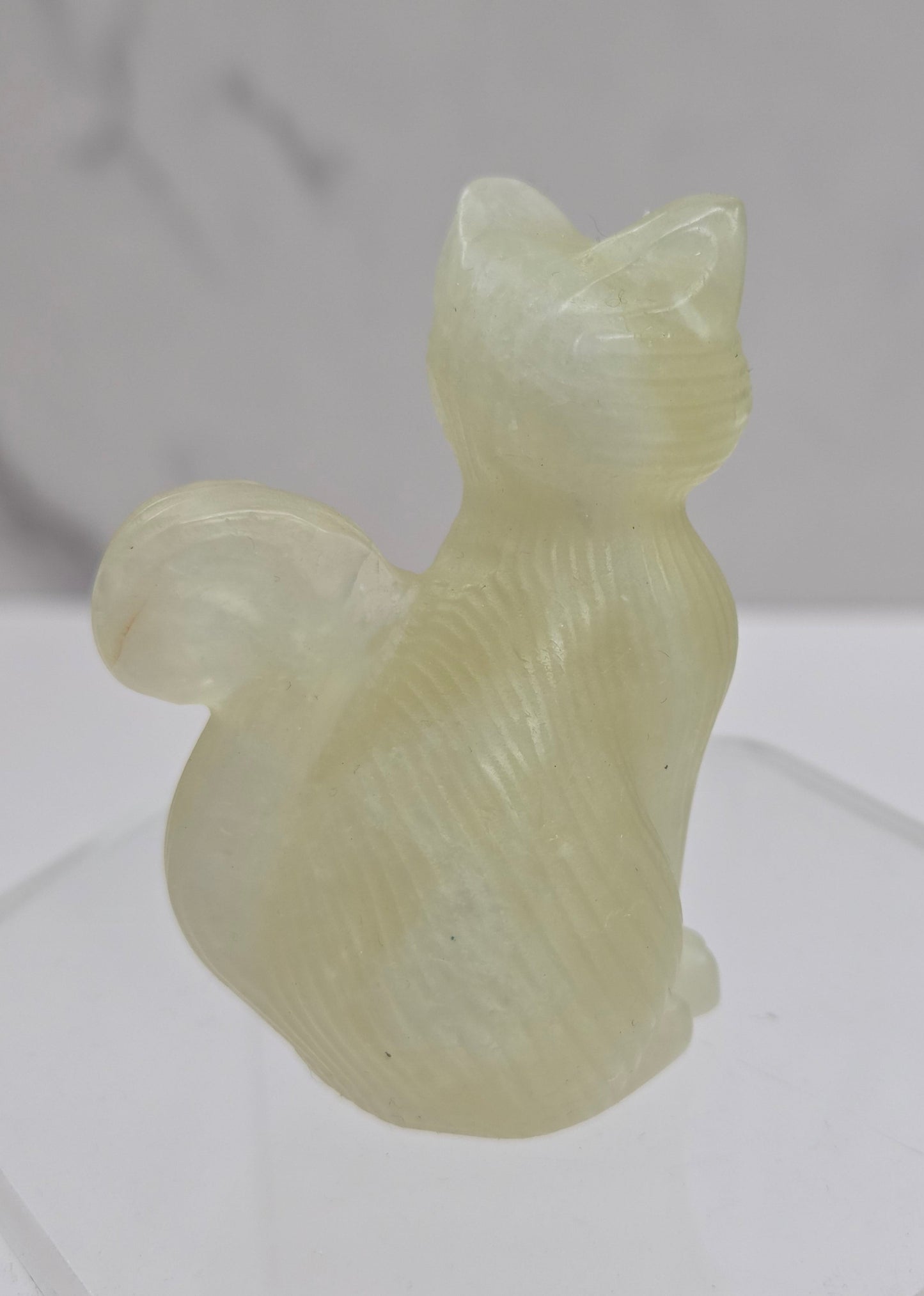 Crystal cat figurine made of Citrine on a white background
