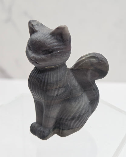 Gray stone cat figurine on a white background