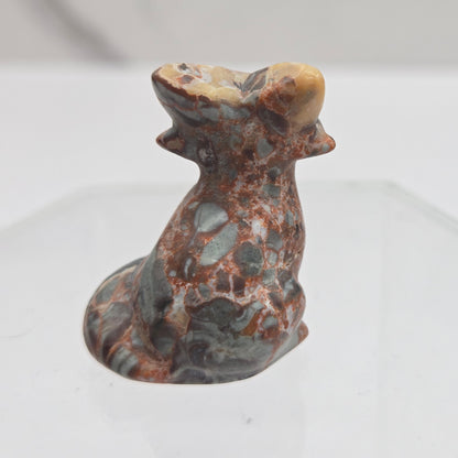 Maligano Jasper fox carving with grey, yellow and red coloring on a white background