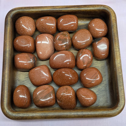 glittering, orange-brown small stones infused with copper particles