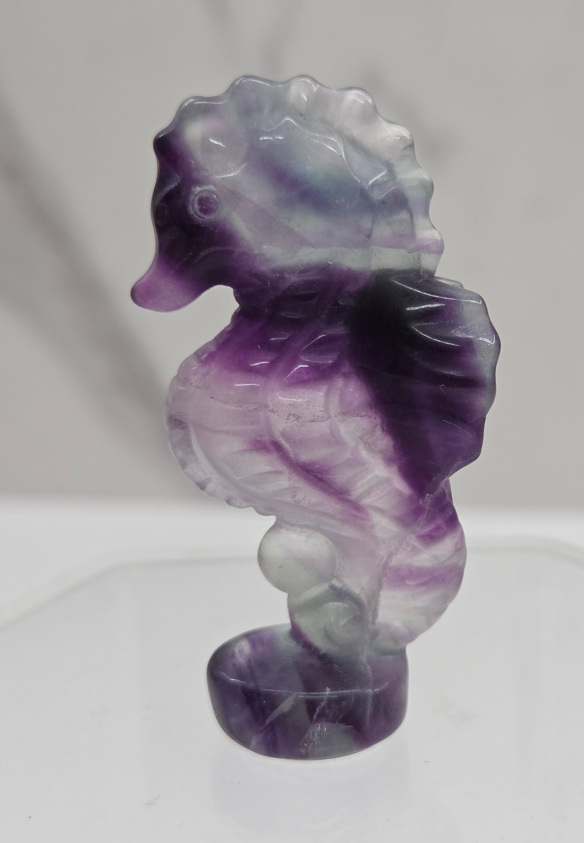 Fluorite crystal seahorse carvings with blue, green and purple colors
