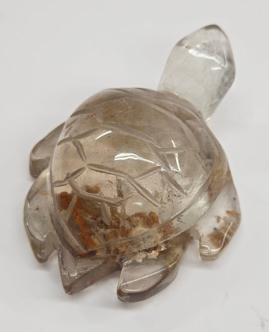 Crystal turtle figurine on a white background