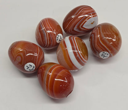 Marbled red and white Carnelian egg carvings