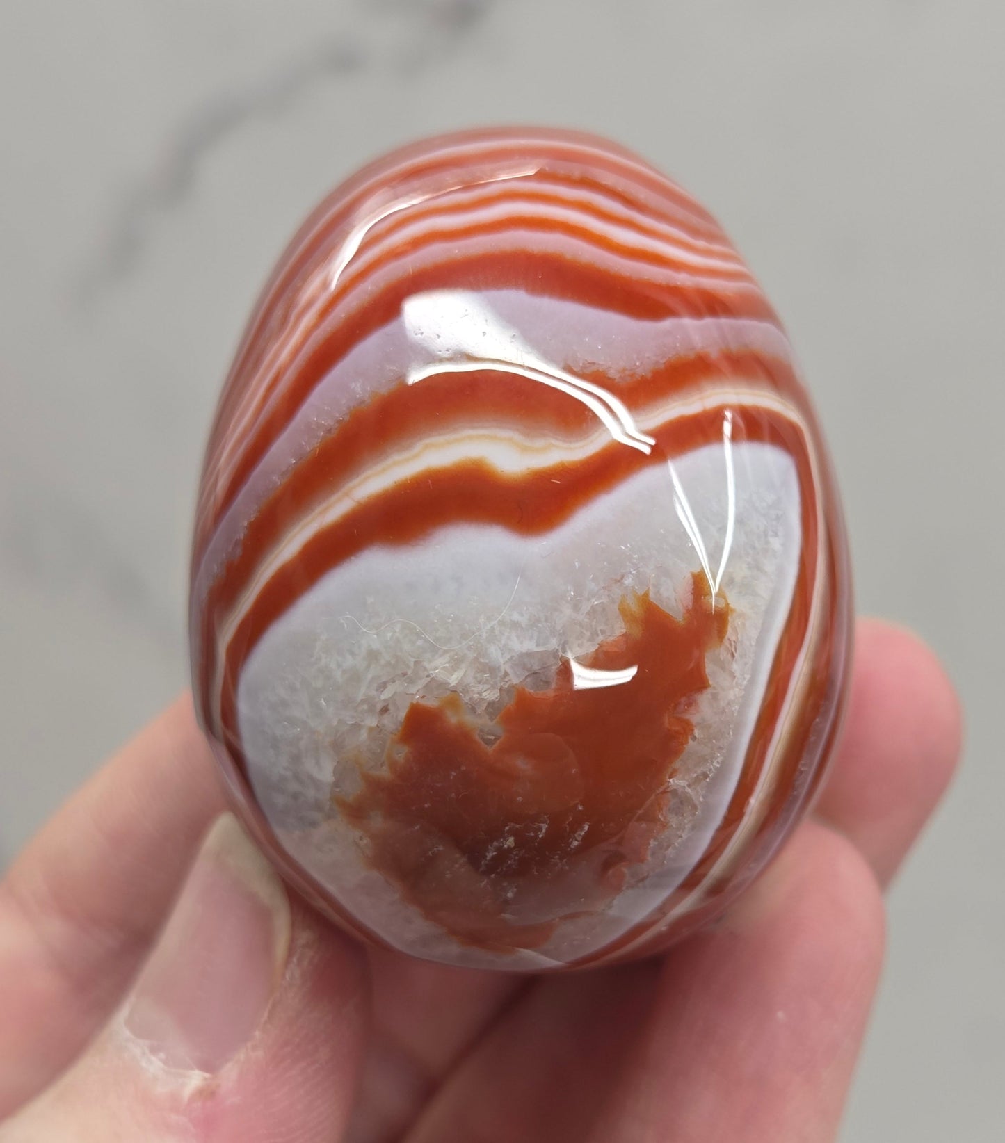 Marbled red and white Carnelian egg carving