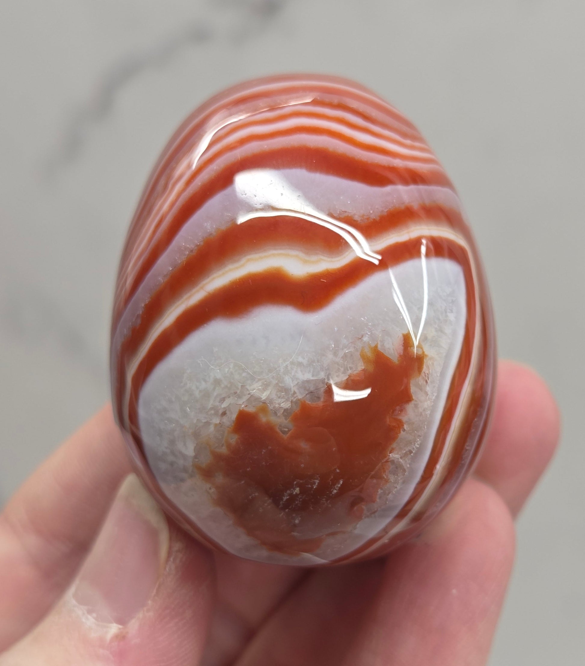 Marbled red and white Carnelian egg carving