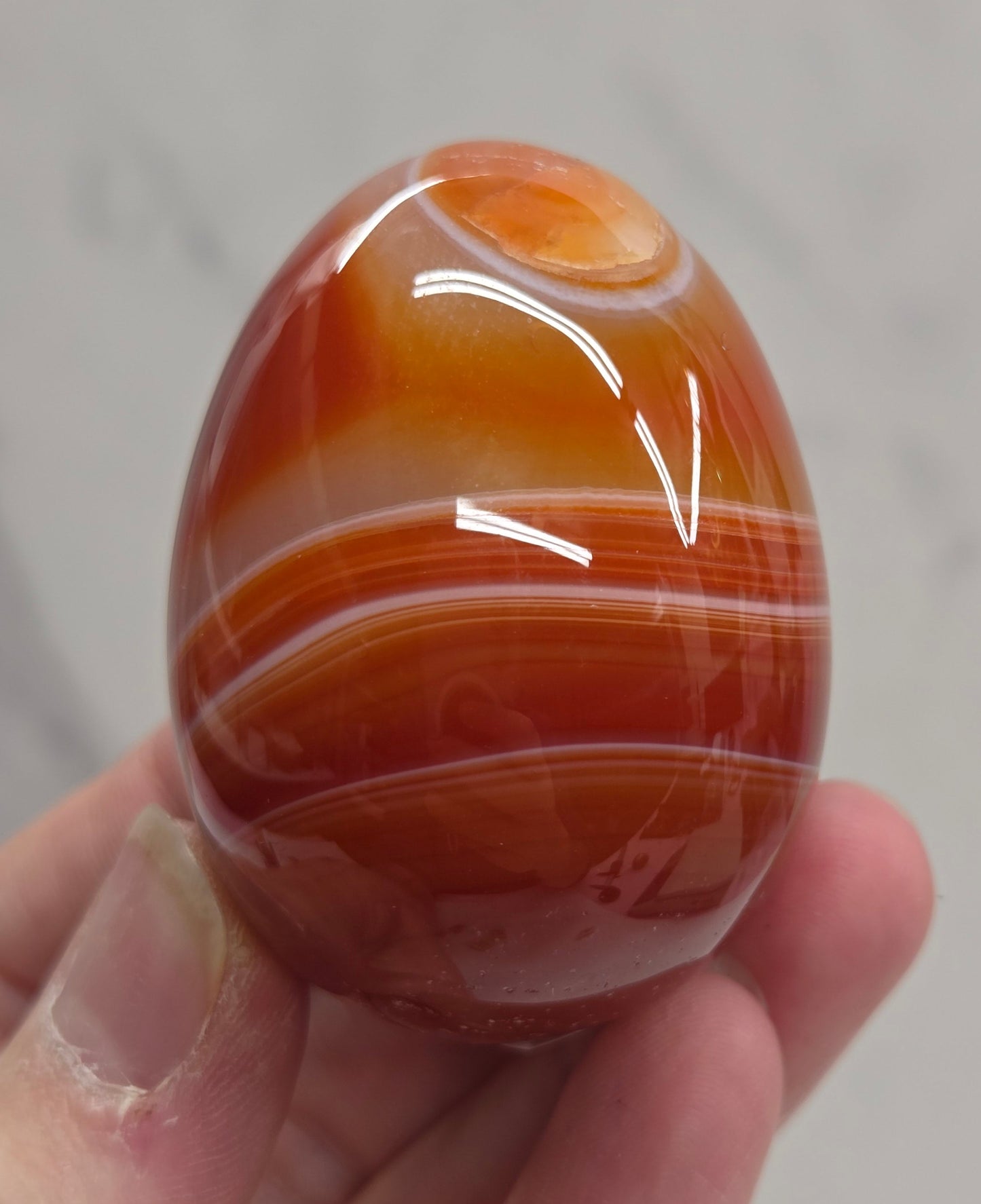 Marbled red and white Carnelian egg carving