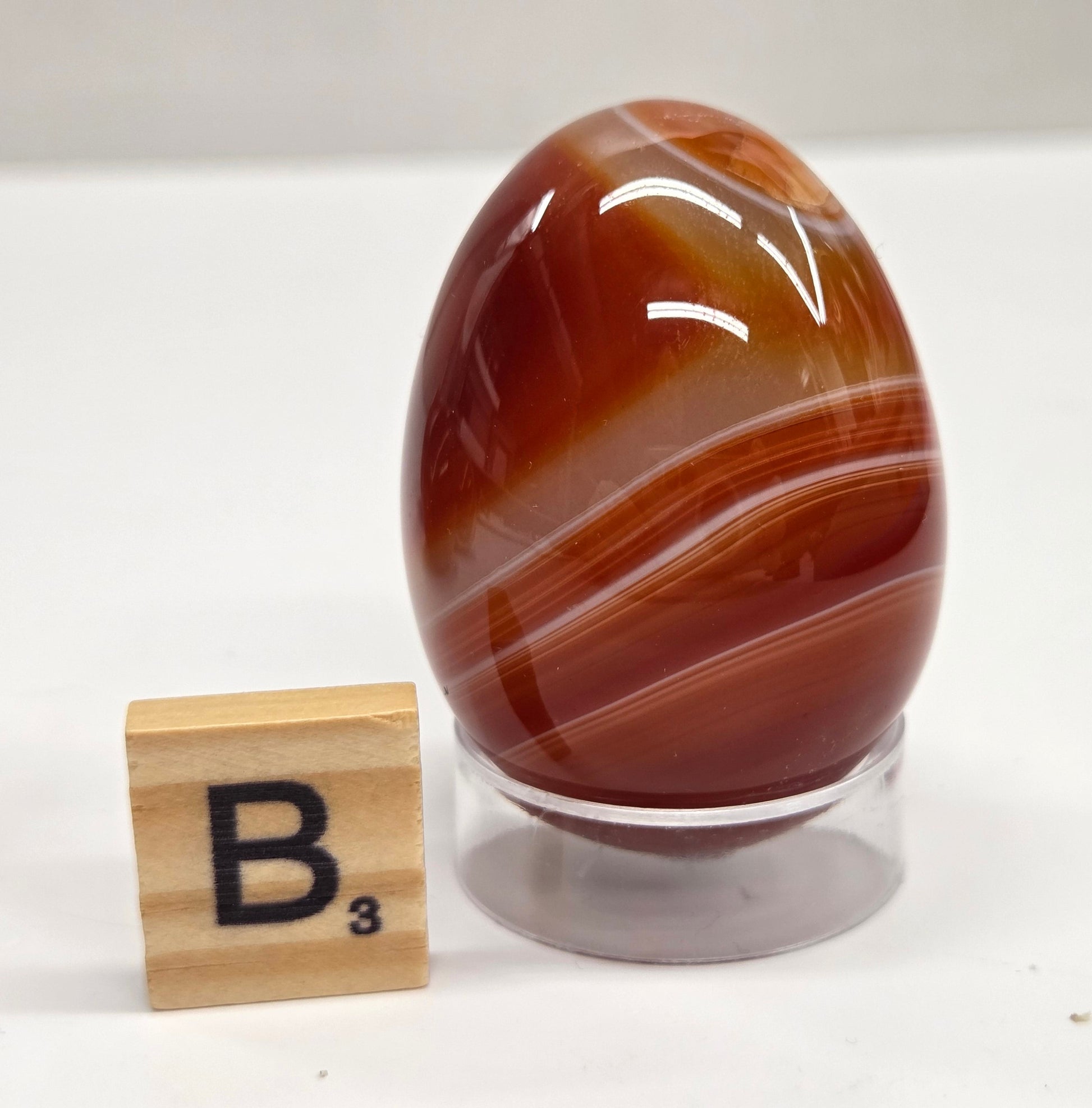 Marbled red and white Carnelian egg carving