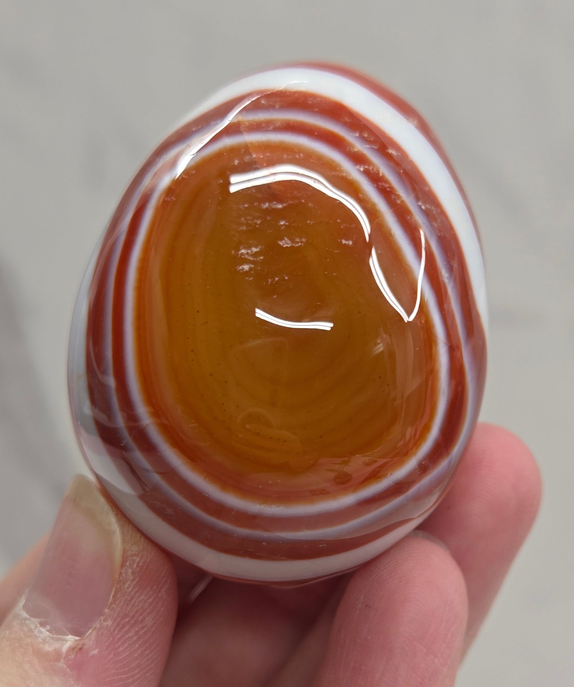 Marbled red and white Carnelian egg carving