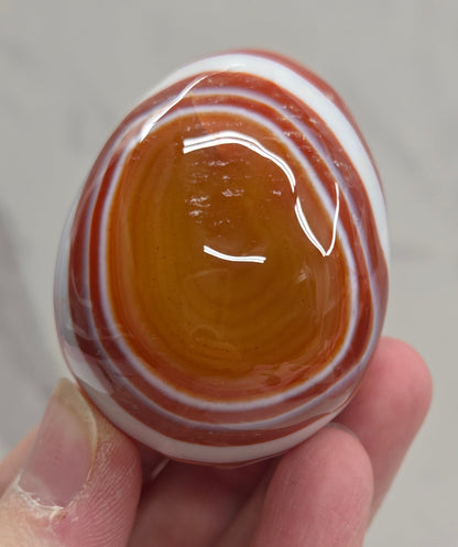 Marbled red and white Carnelian egg carving