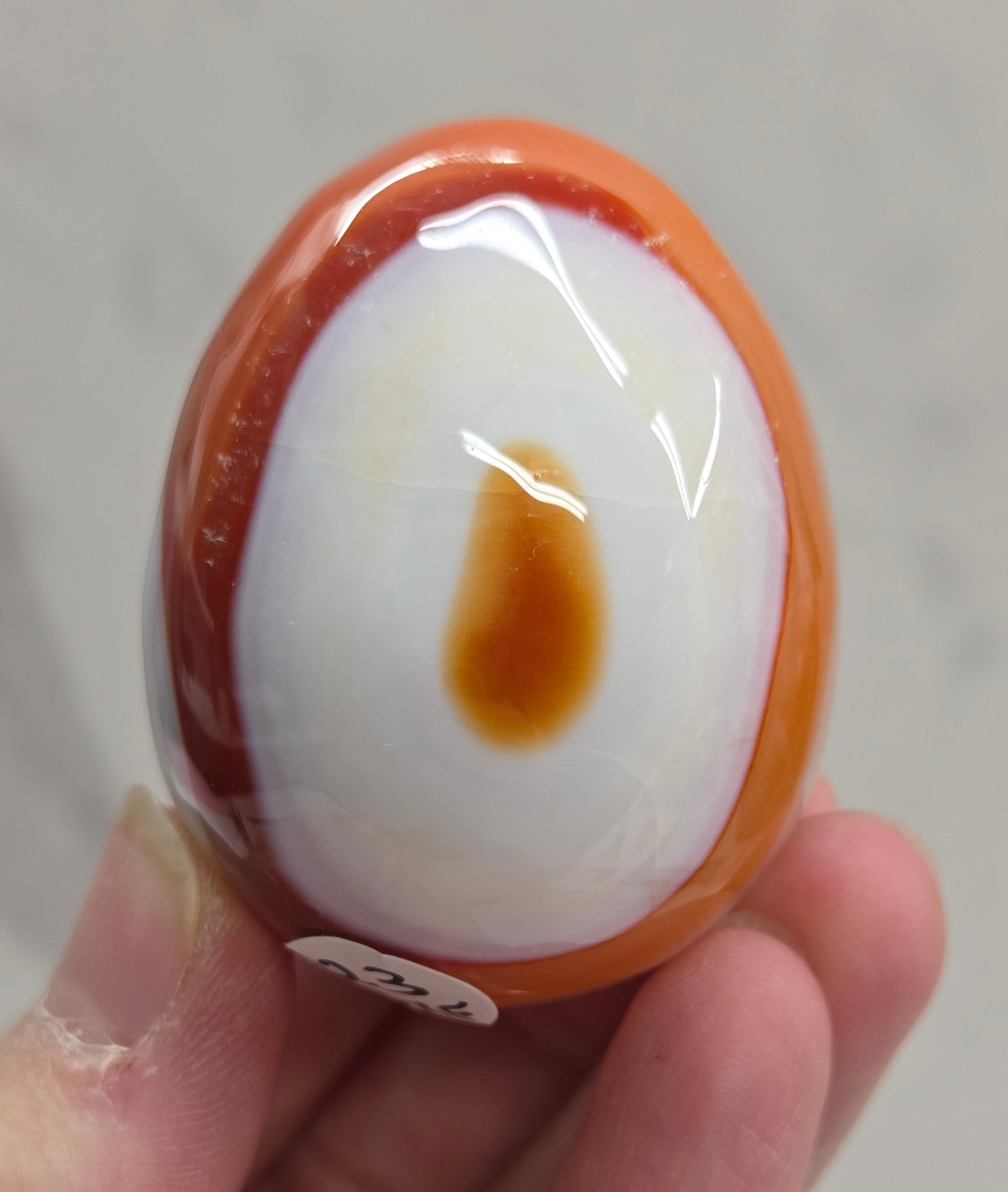 Marbled red and white Carnelian egg carving