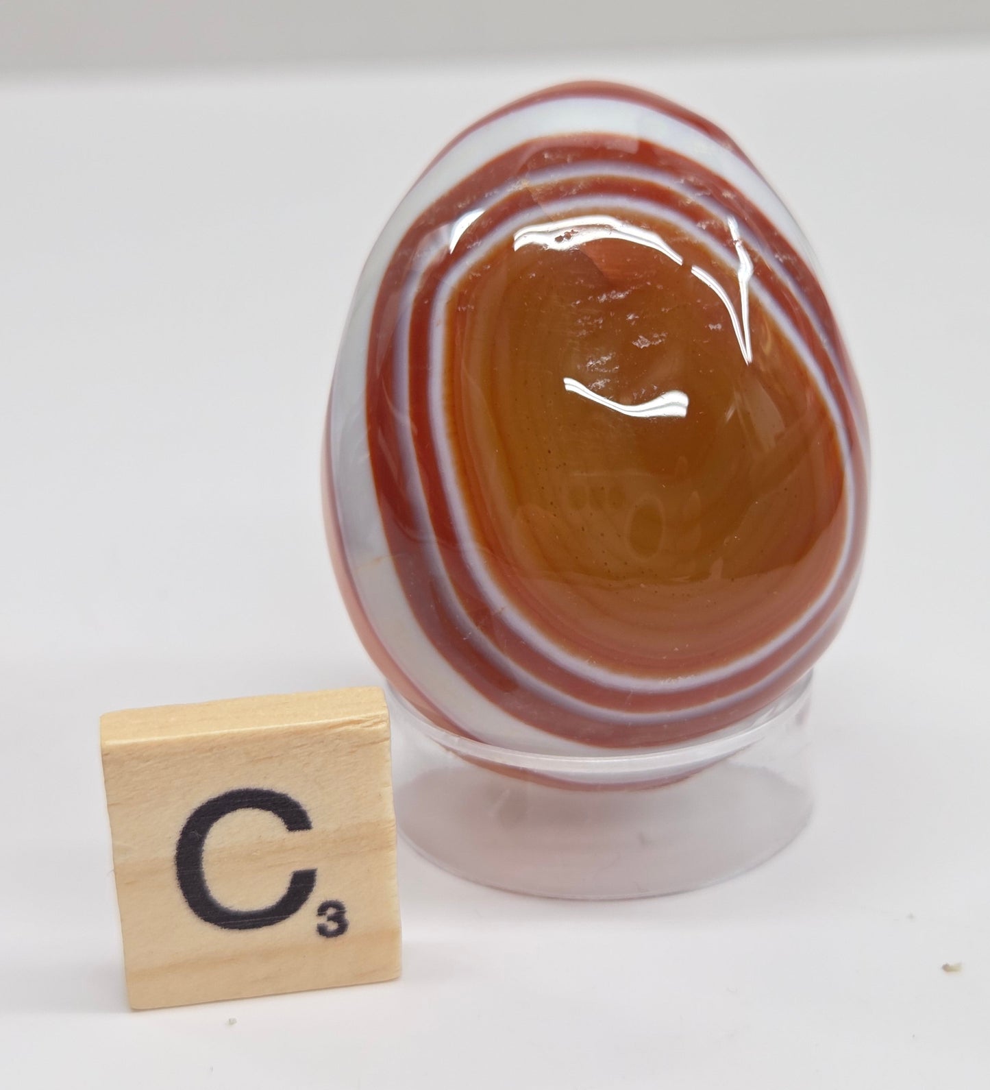 Marbled red and white Carnelian egg carving