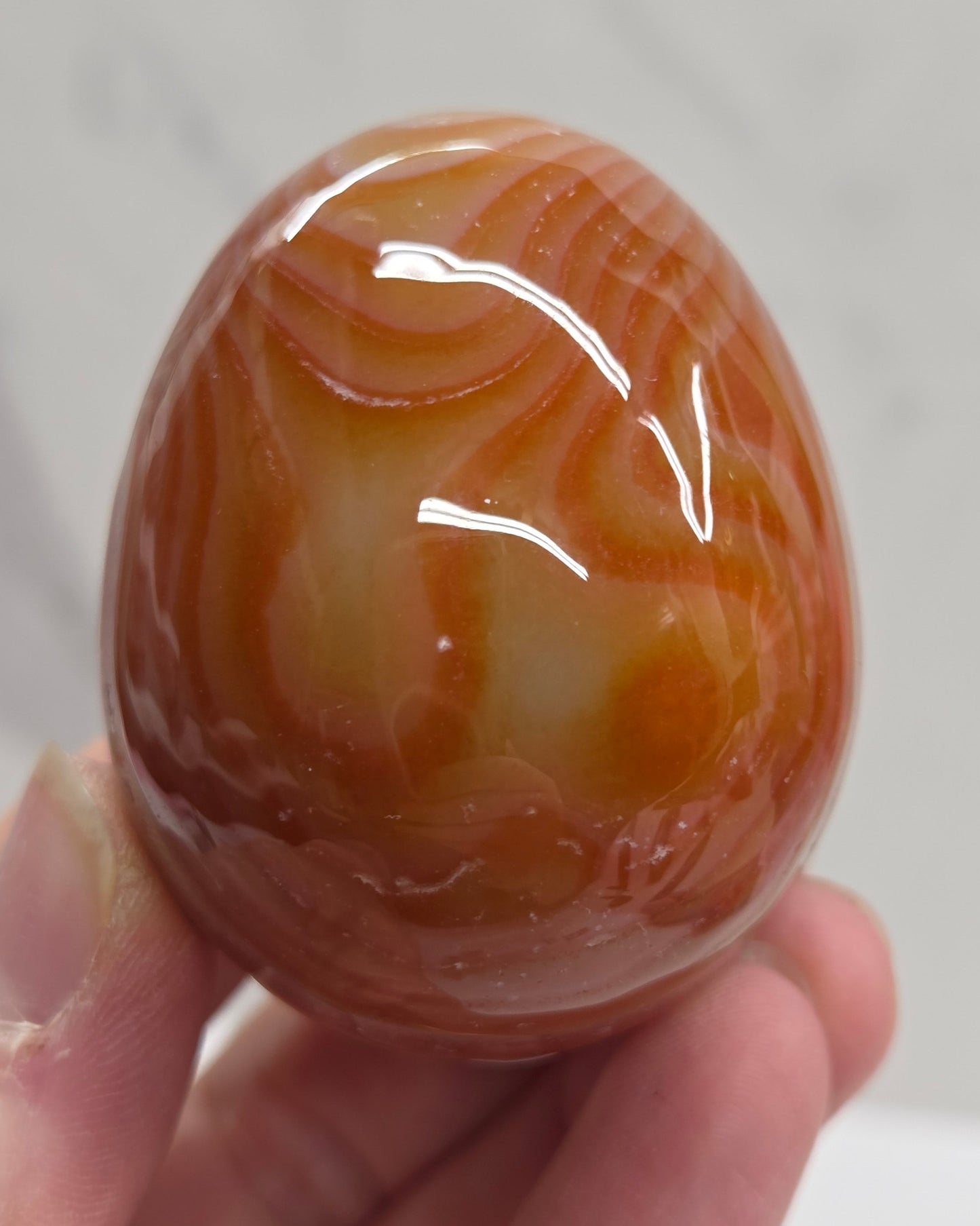 Marbled red and white Carnelian egg carving