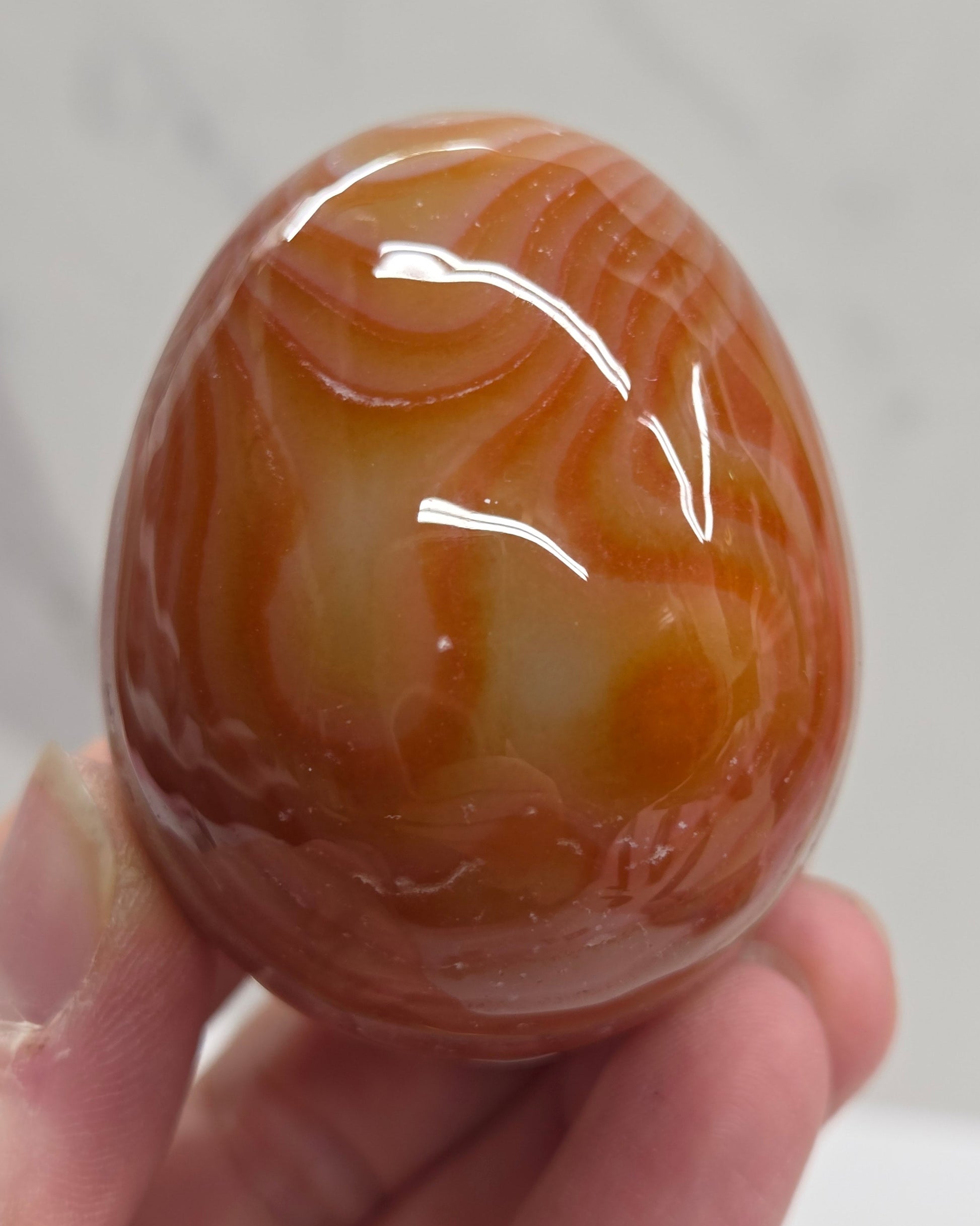 Marbled red and white Carnelian egg carving