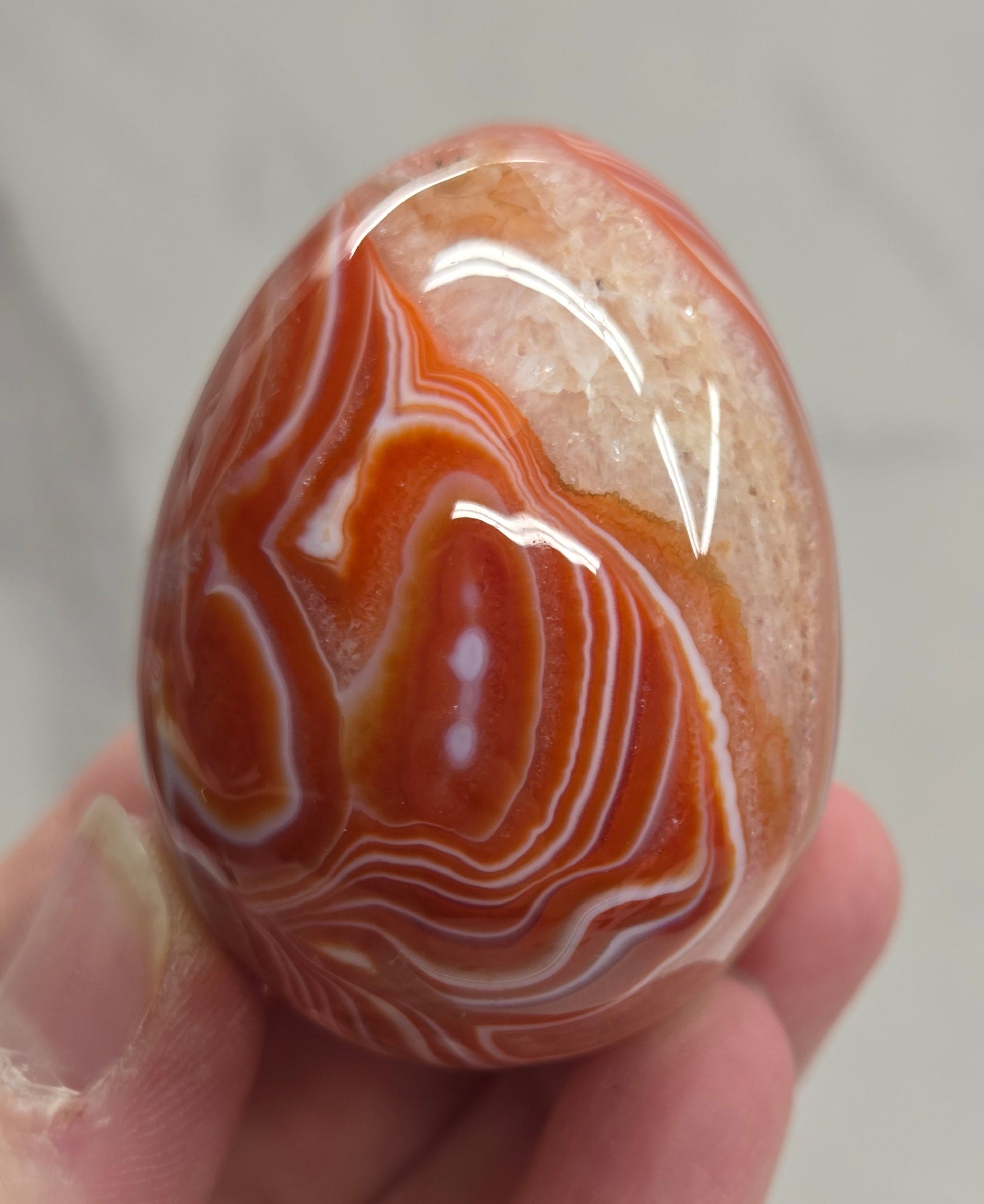 Marbled red and white Carnelian egg carving