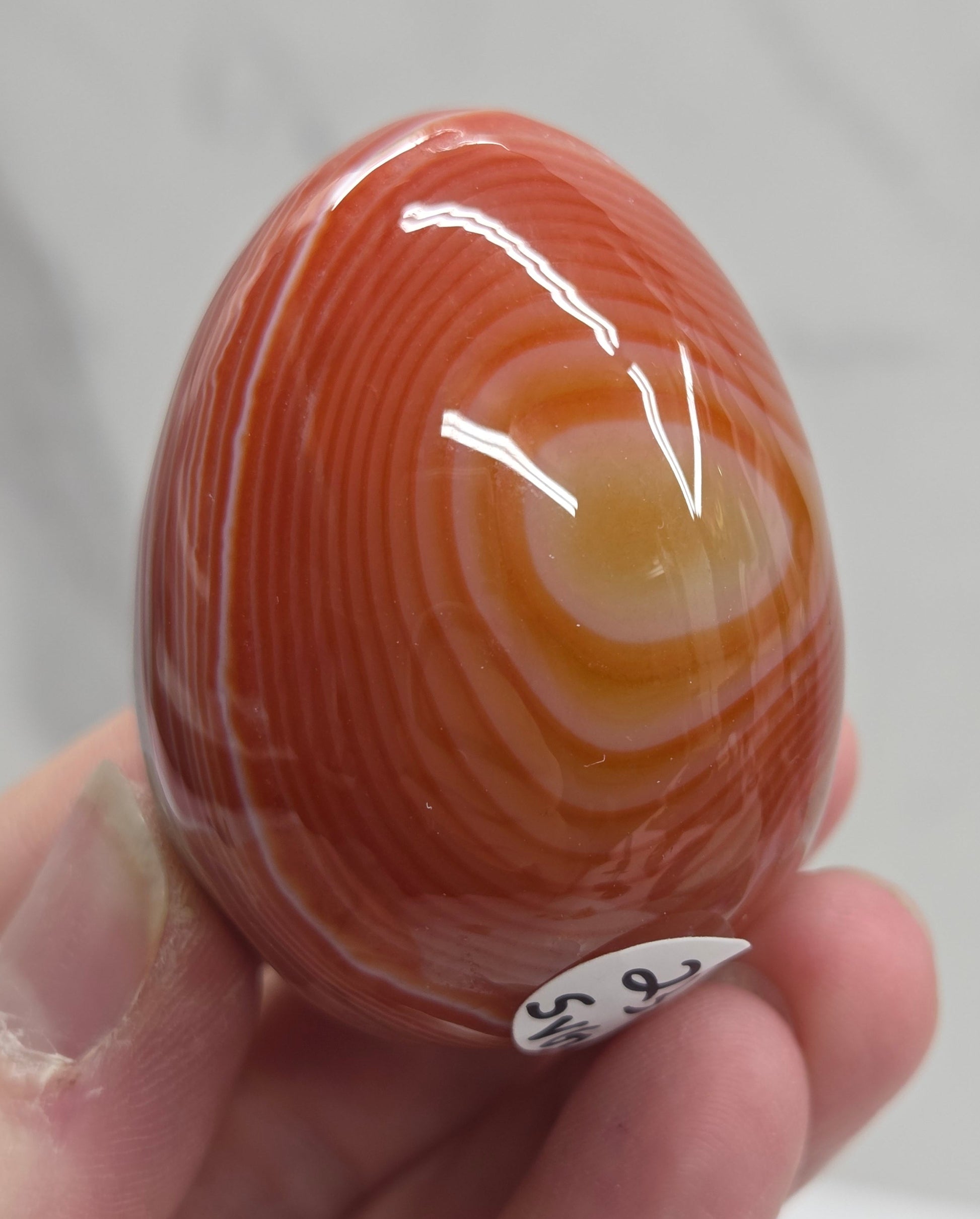 Marbled red and white Carnelian egg carving
