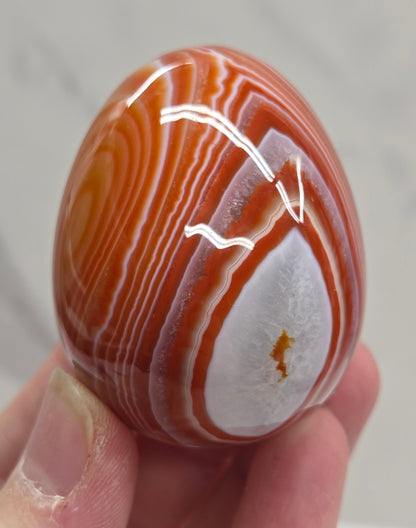 Marbled red and white Carnelian egg carving