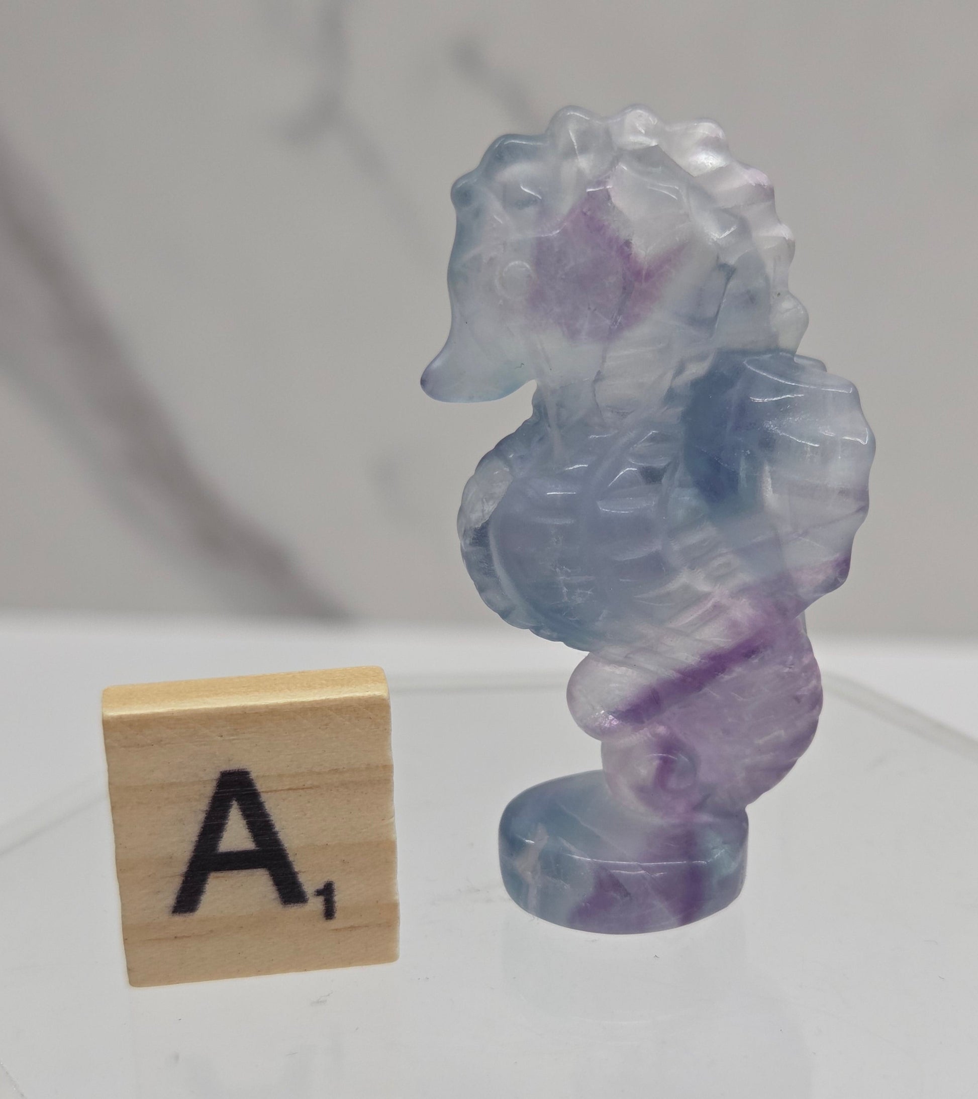 Fluorite crystal seahorse carvings with blue, green and purple colors