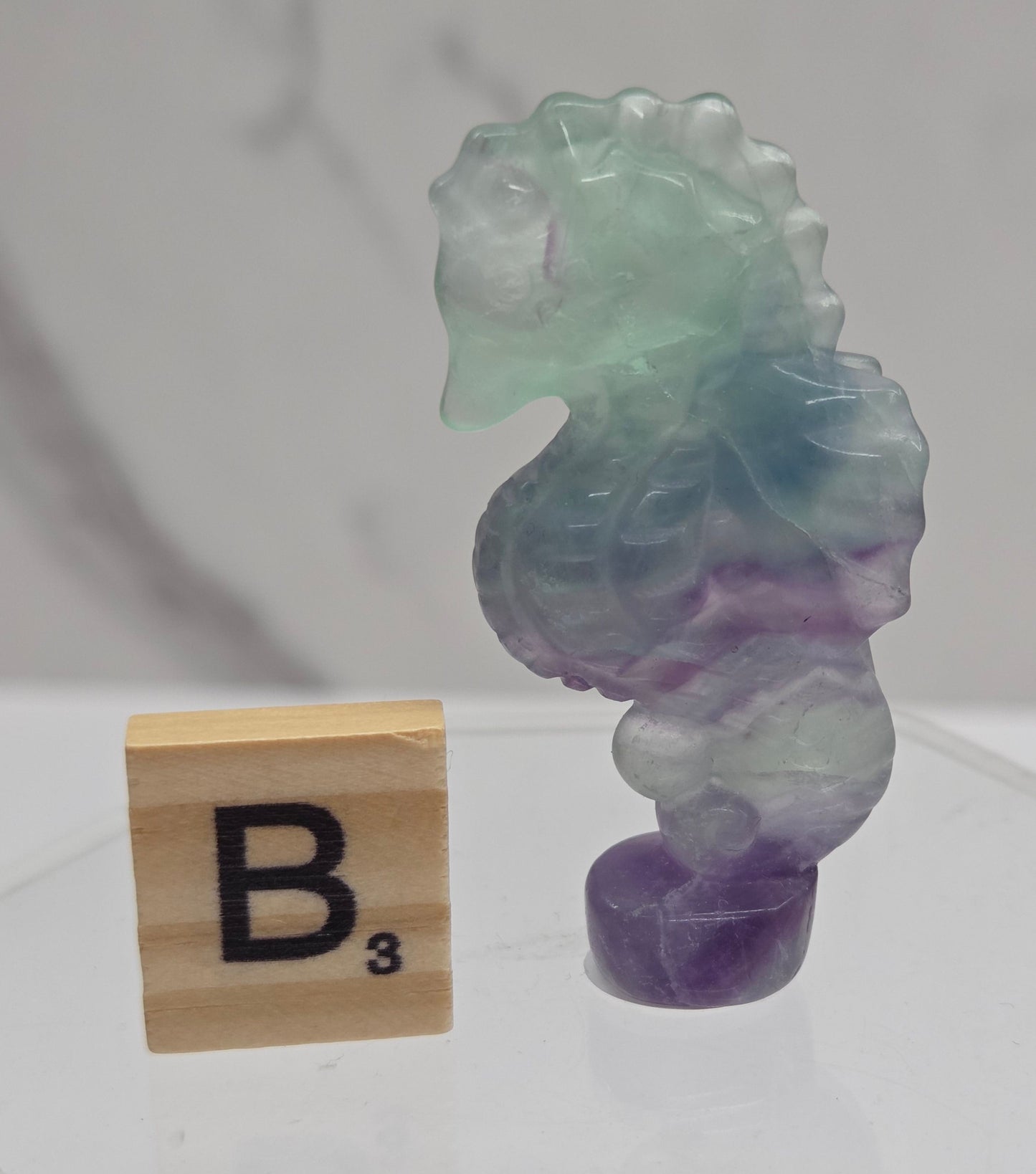 Fluorite crystal seahorse carvings with blue, green and purple colors