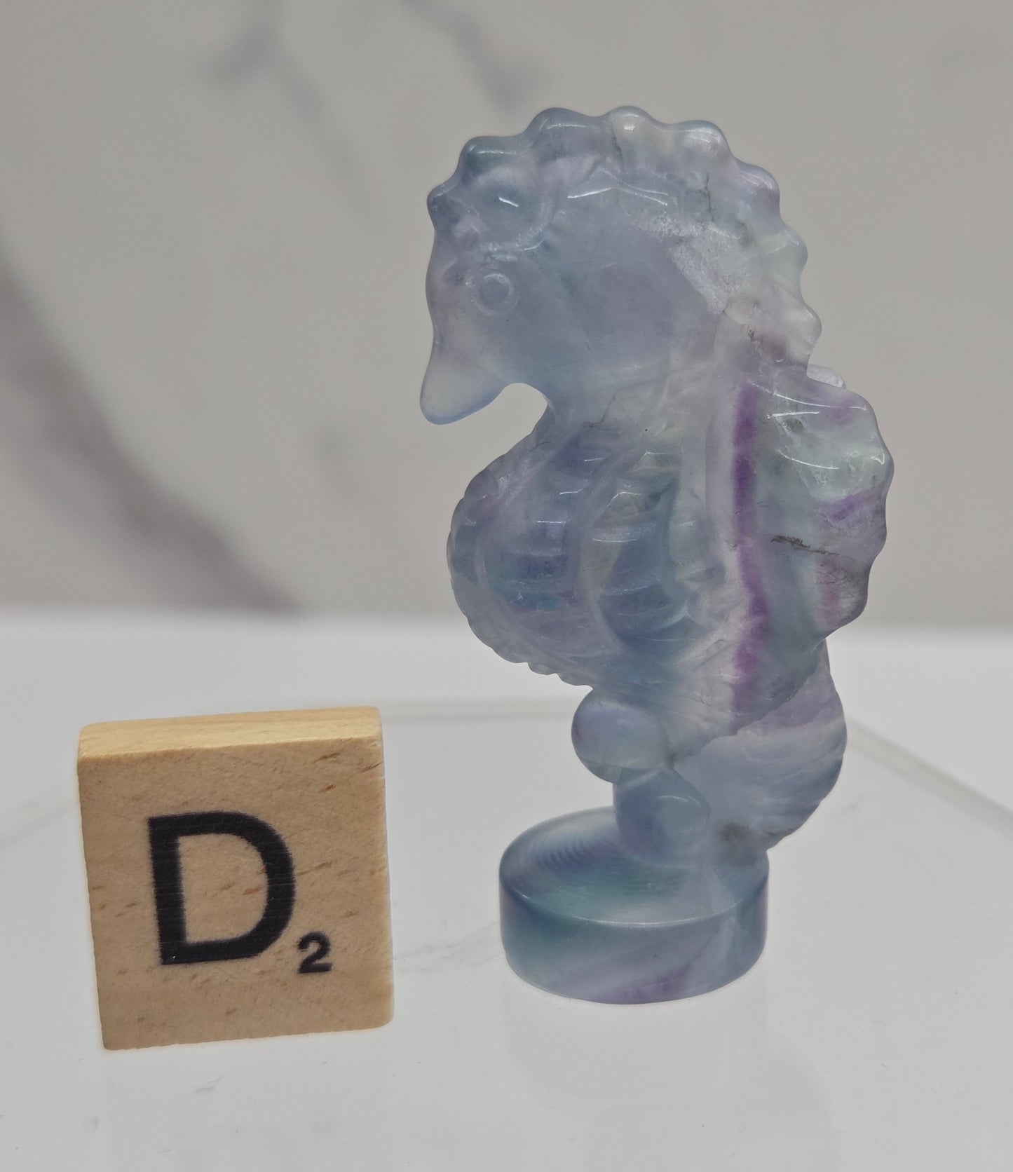 Fluorite crystal seahorse carvings with blue, green and purple colors