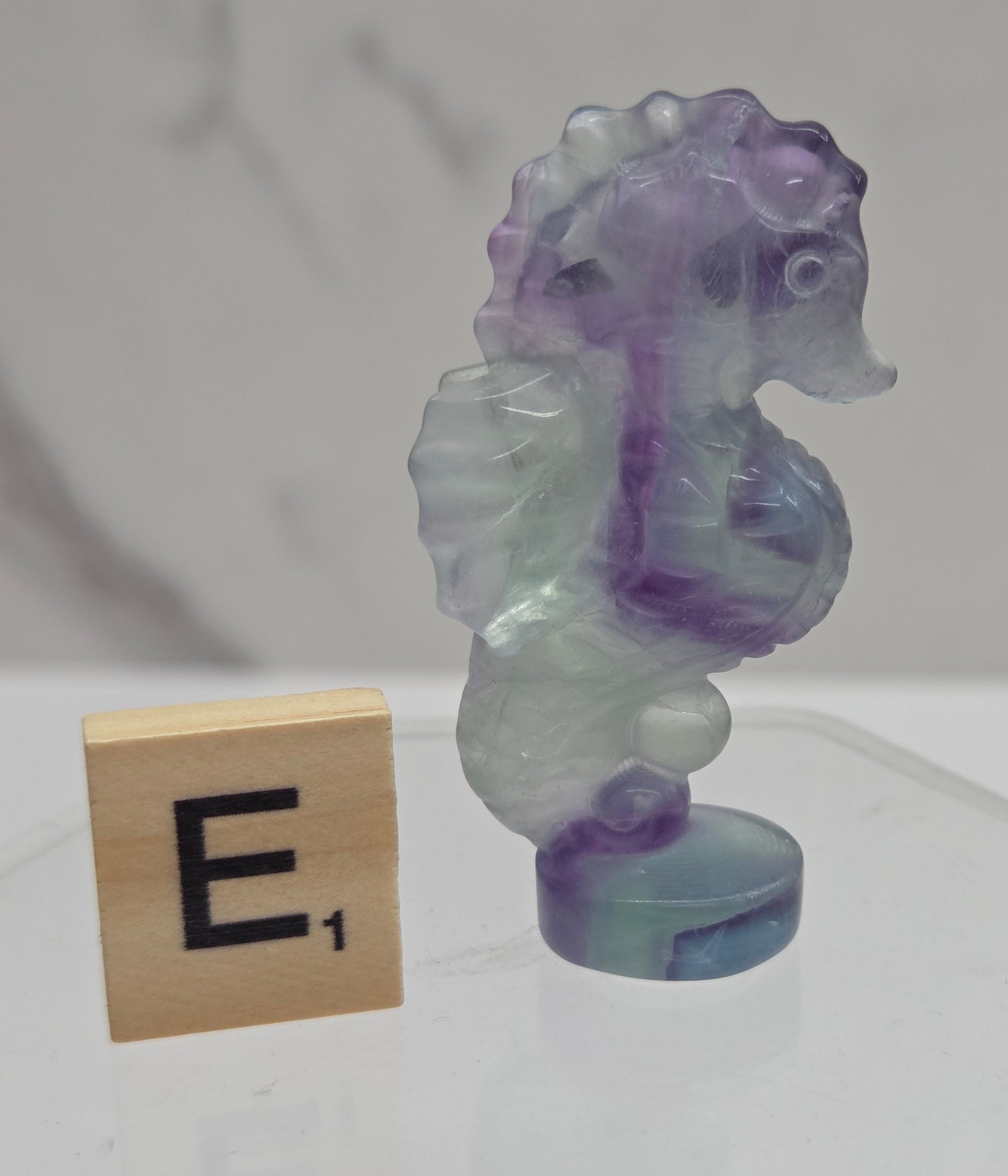 Fluorite crystal seahorse carvings with blue, green and purple colors
