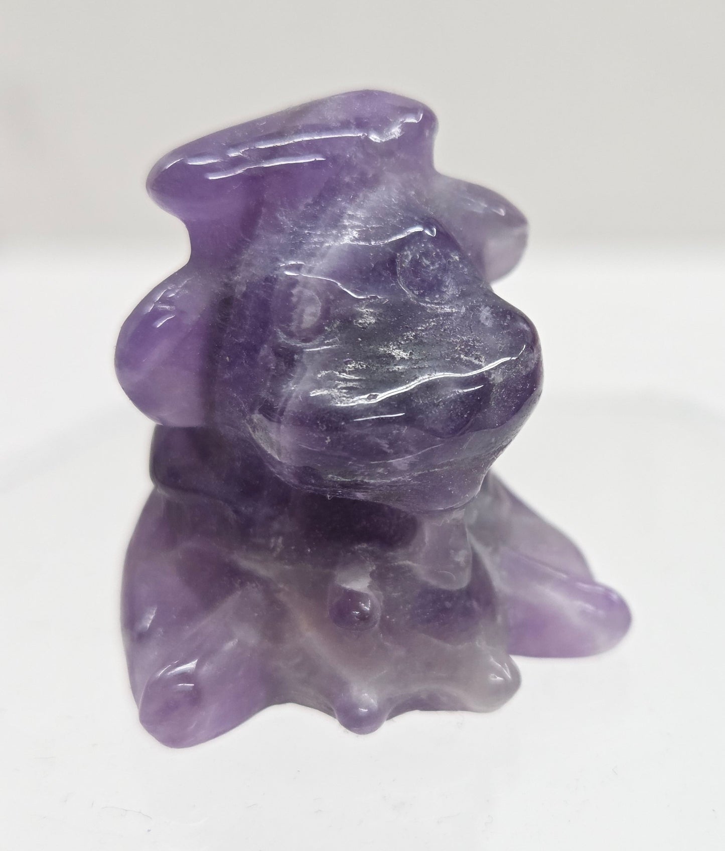 Small, self-milking cow sculptures made of Dream Amethyst