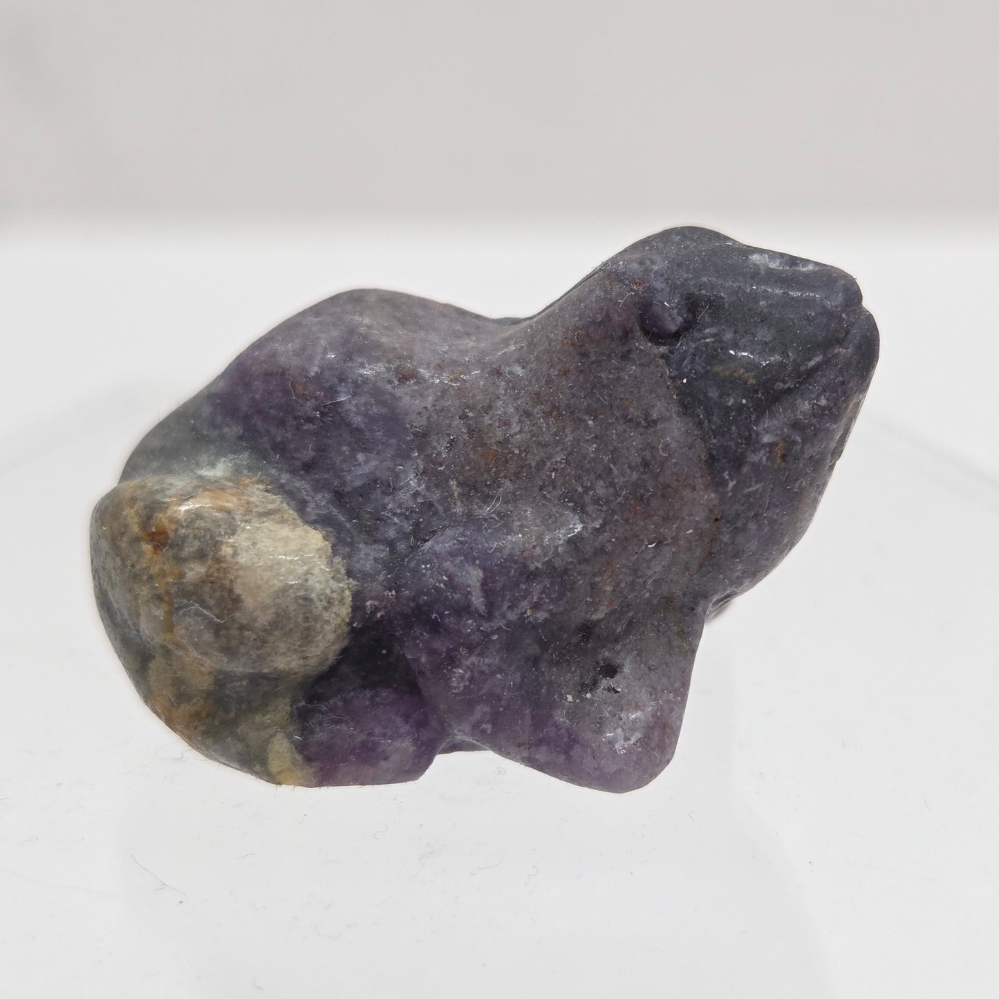 Fluorite Root frog carving on a white background