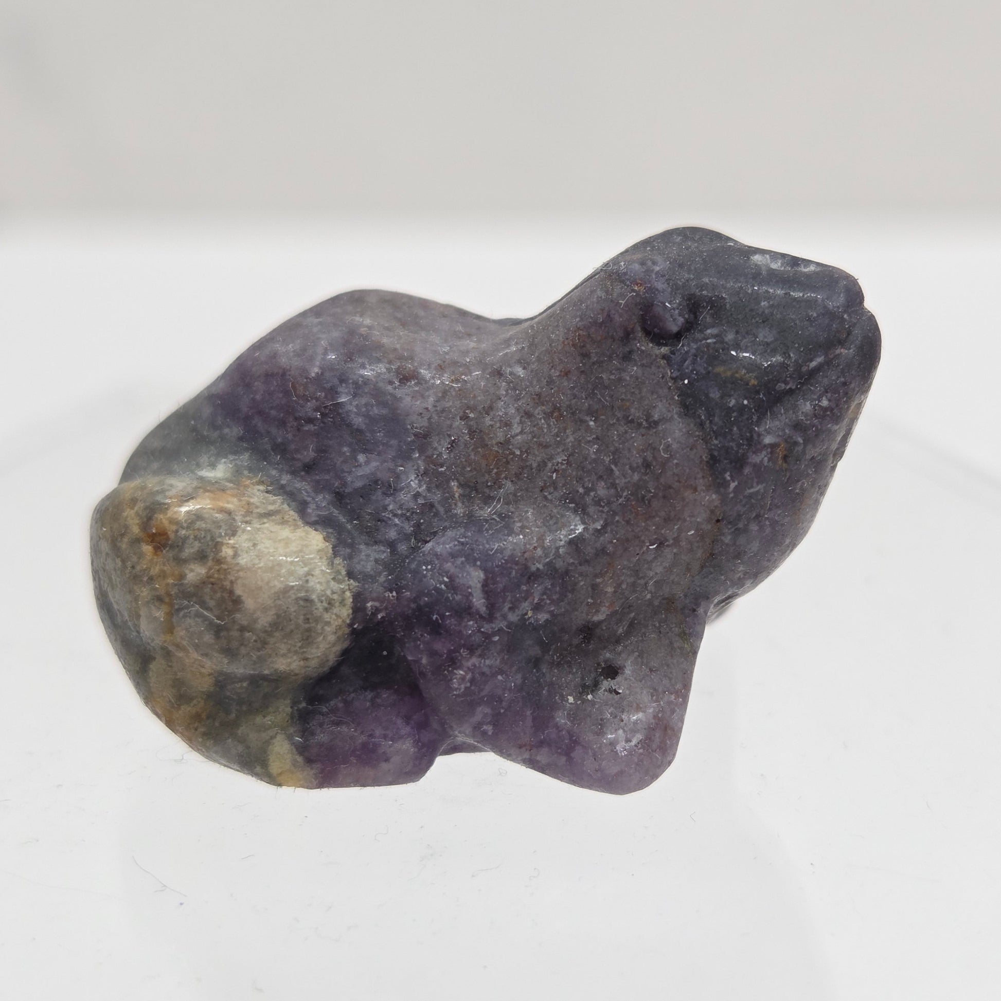 Fluorite Root frog carving on a white background