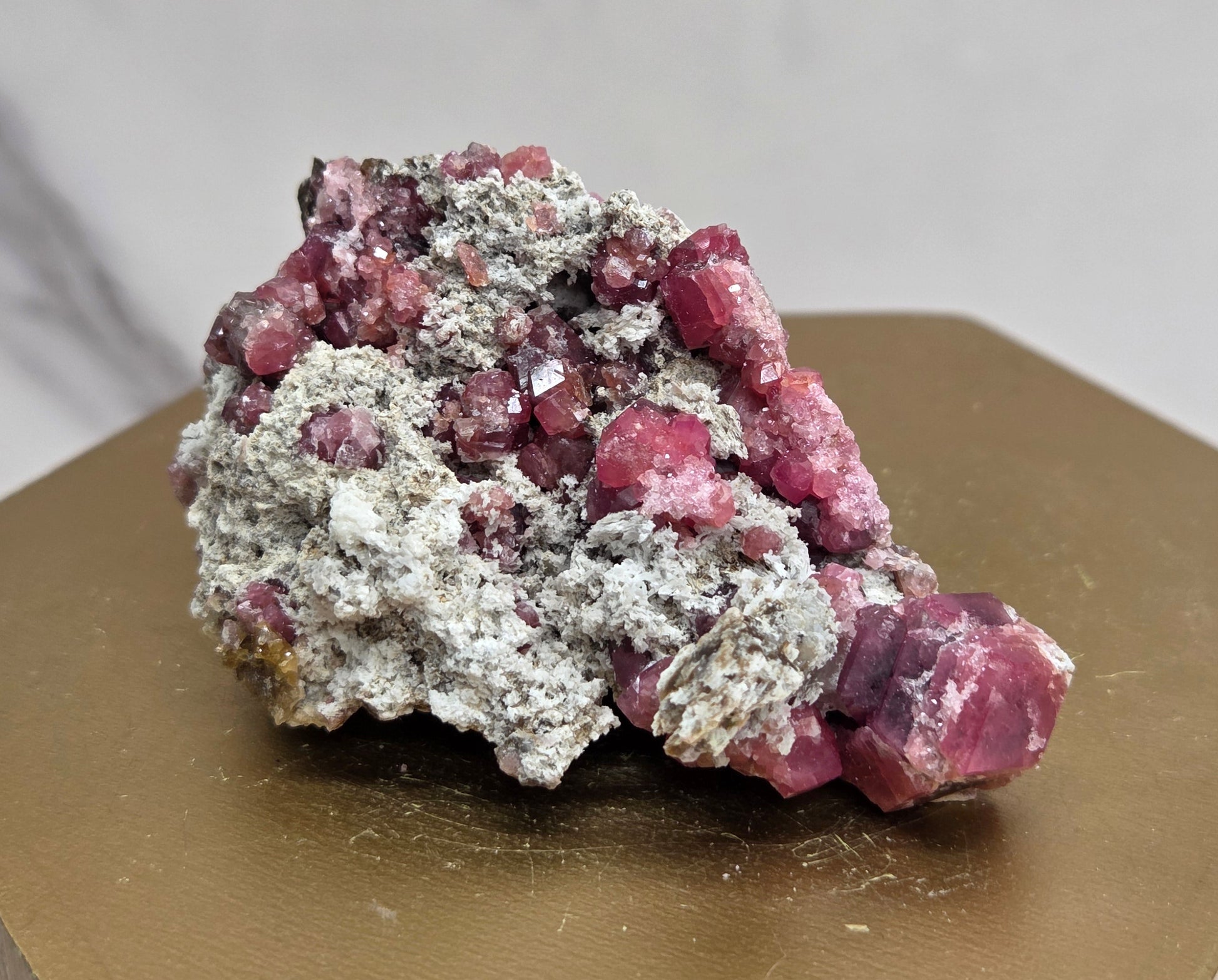 Mineral sample of Pink Garnet on white matrix