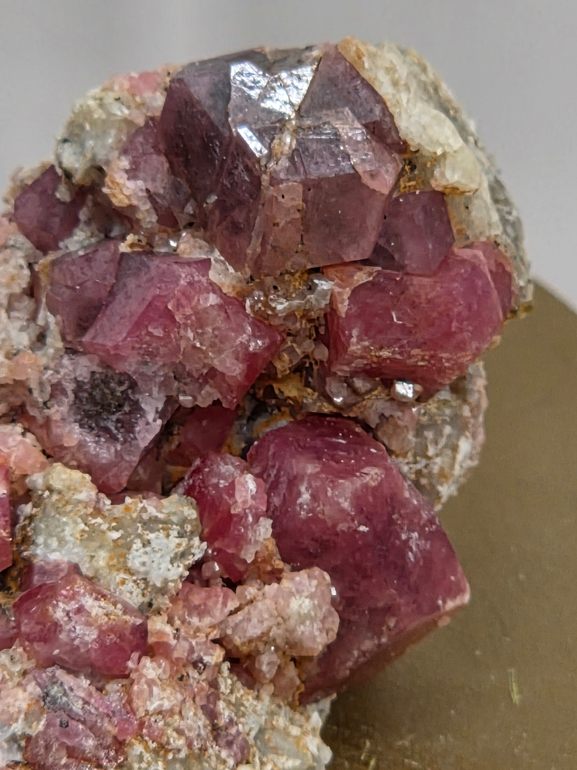 Close-up of pink crystal formation on a gray background