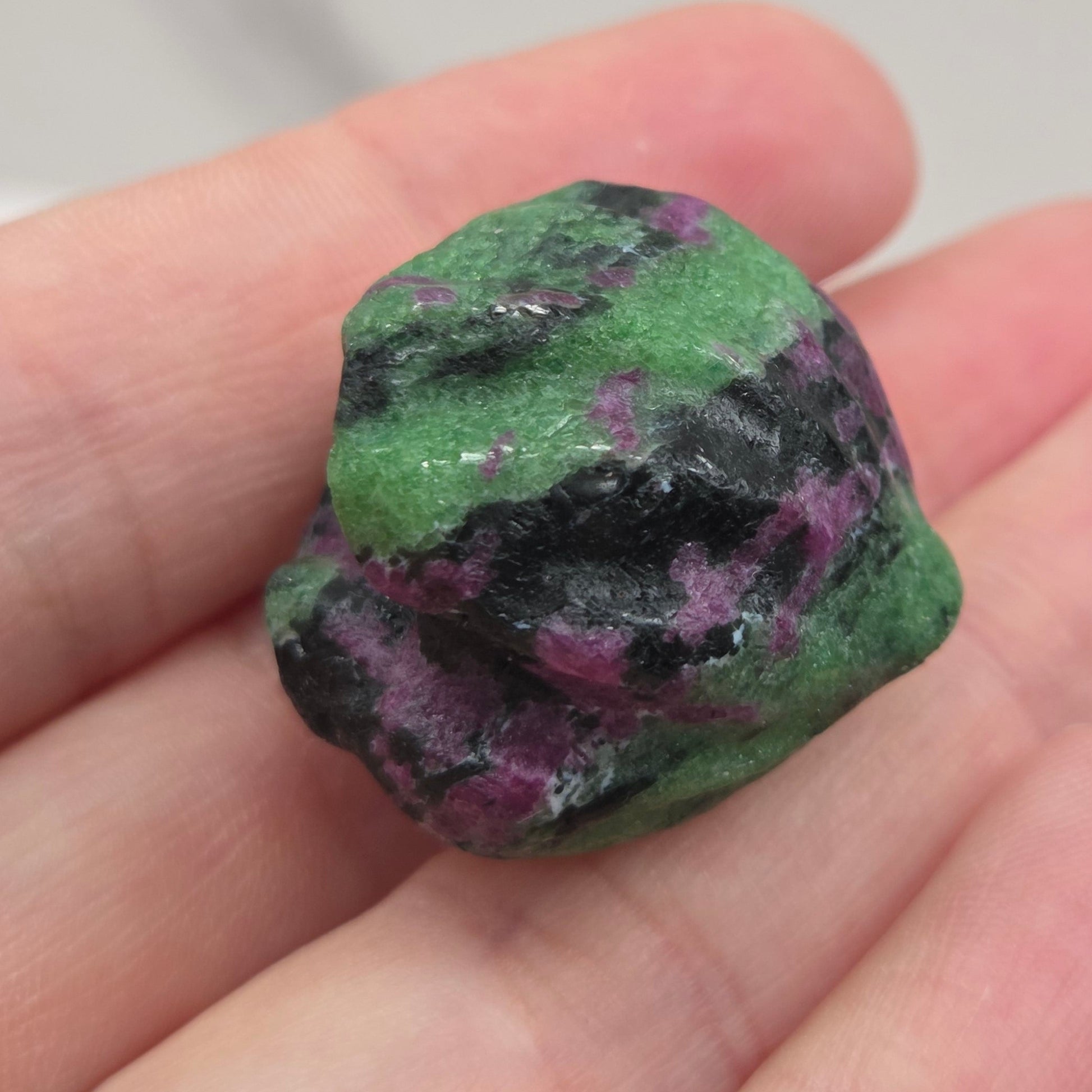 Ruby Zoisite crystal clam carving with green, black and pink coloring