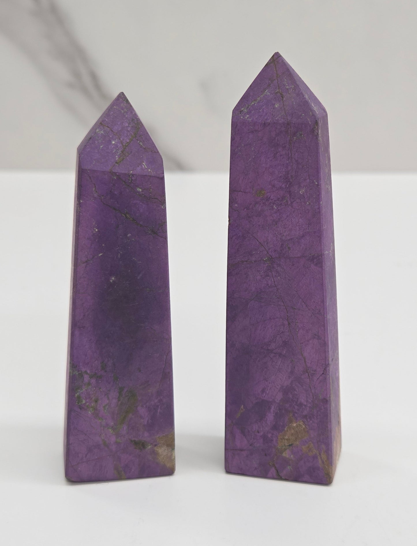 Two purple Purpurite crystal points 
