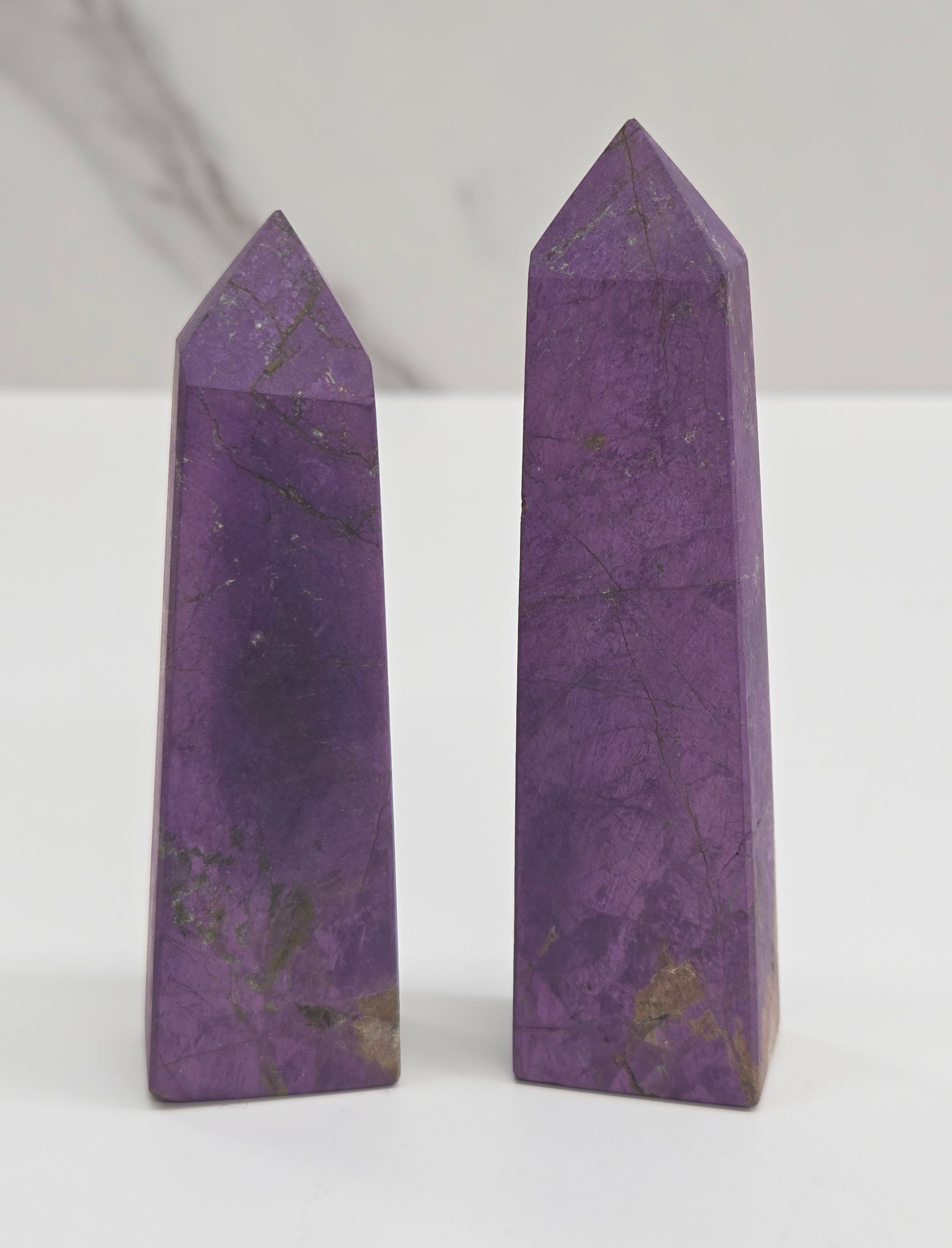 Two purple Purpurite crystal points 