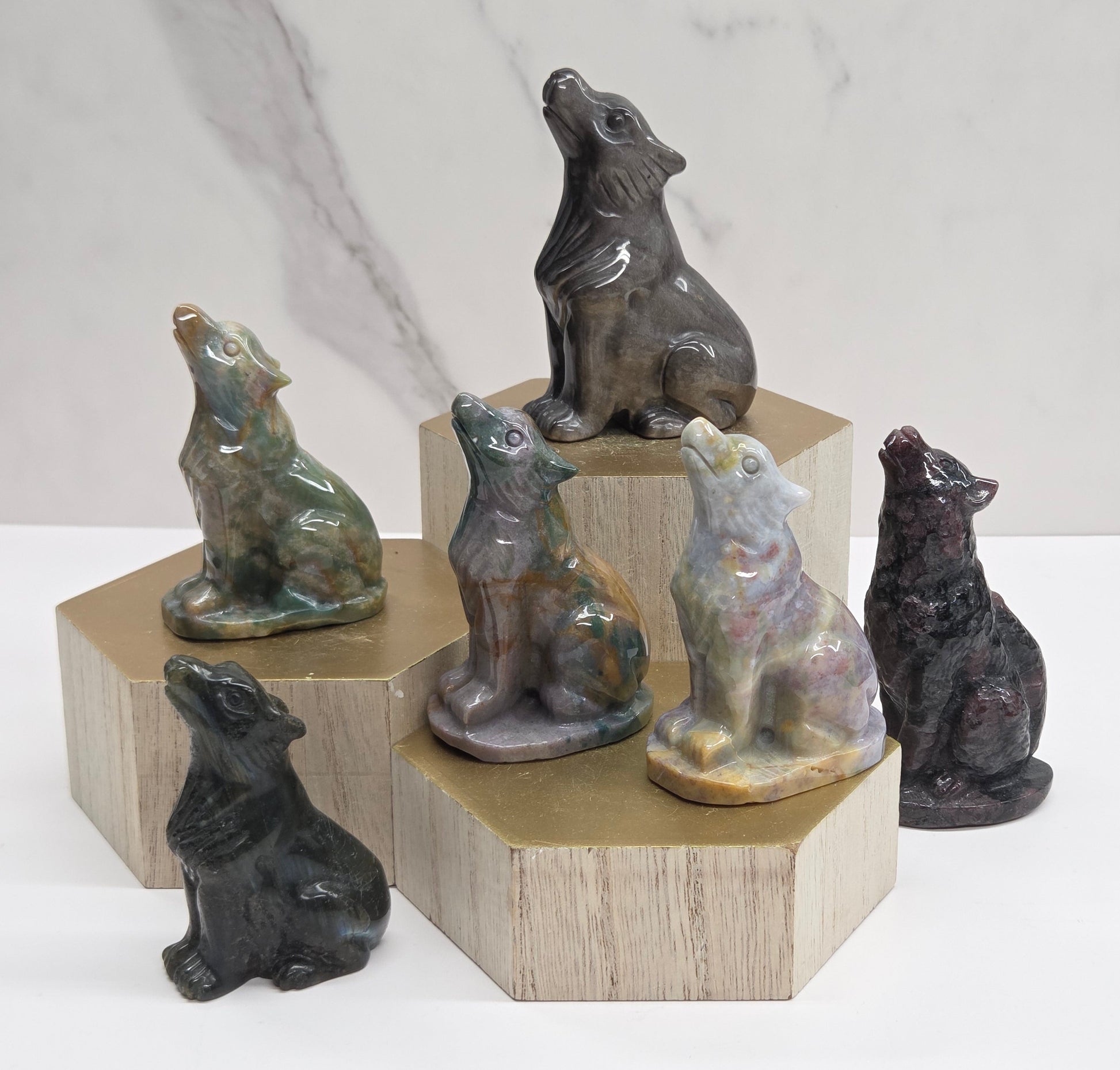 Wooden block with crystal wolf carvings in a variety of colors and materials