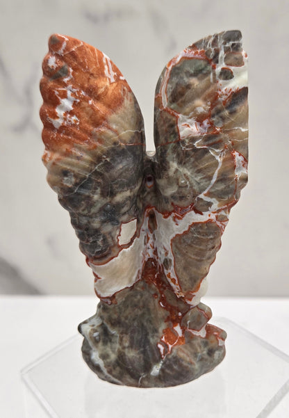 Money Agate praying angel carving on an acrylic stand on a white background