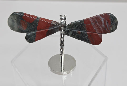 African Bloodstone Dragonfly-shaped wings on a metal stand on a clear stand with a white background