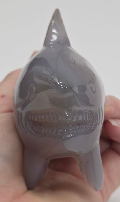 Grey Agate shark carving on a white background