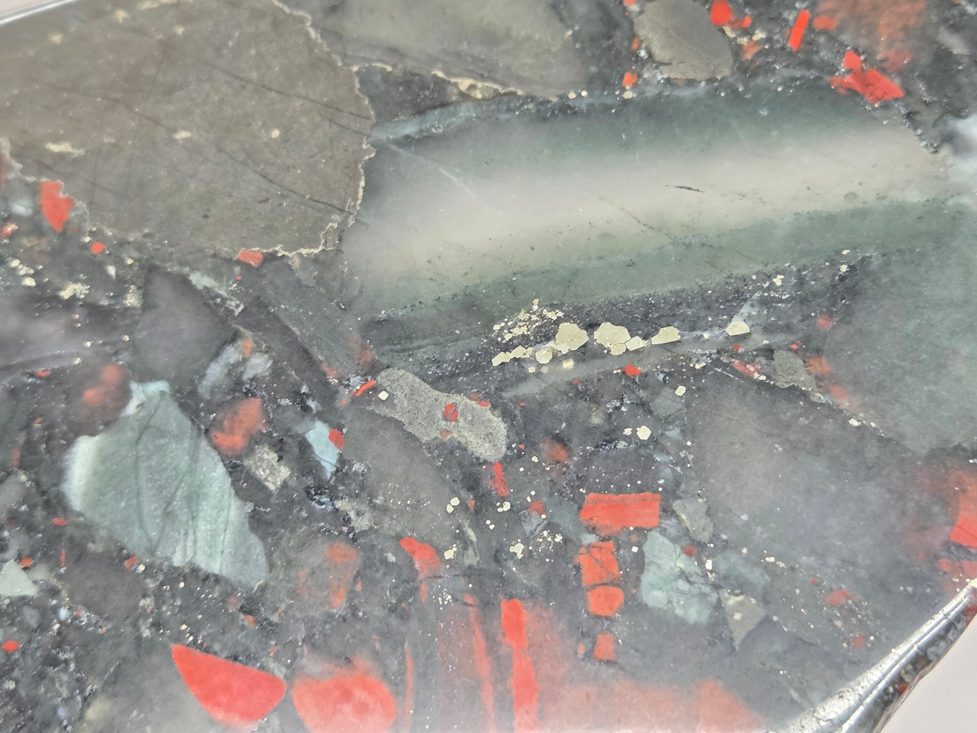 Close-up of a Dark stone African Bloodstone slab with red and gray patterns